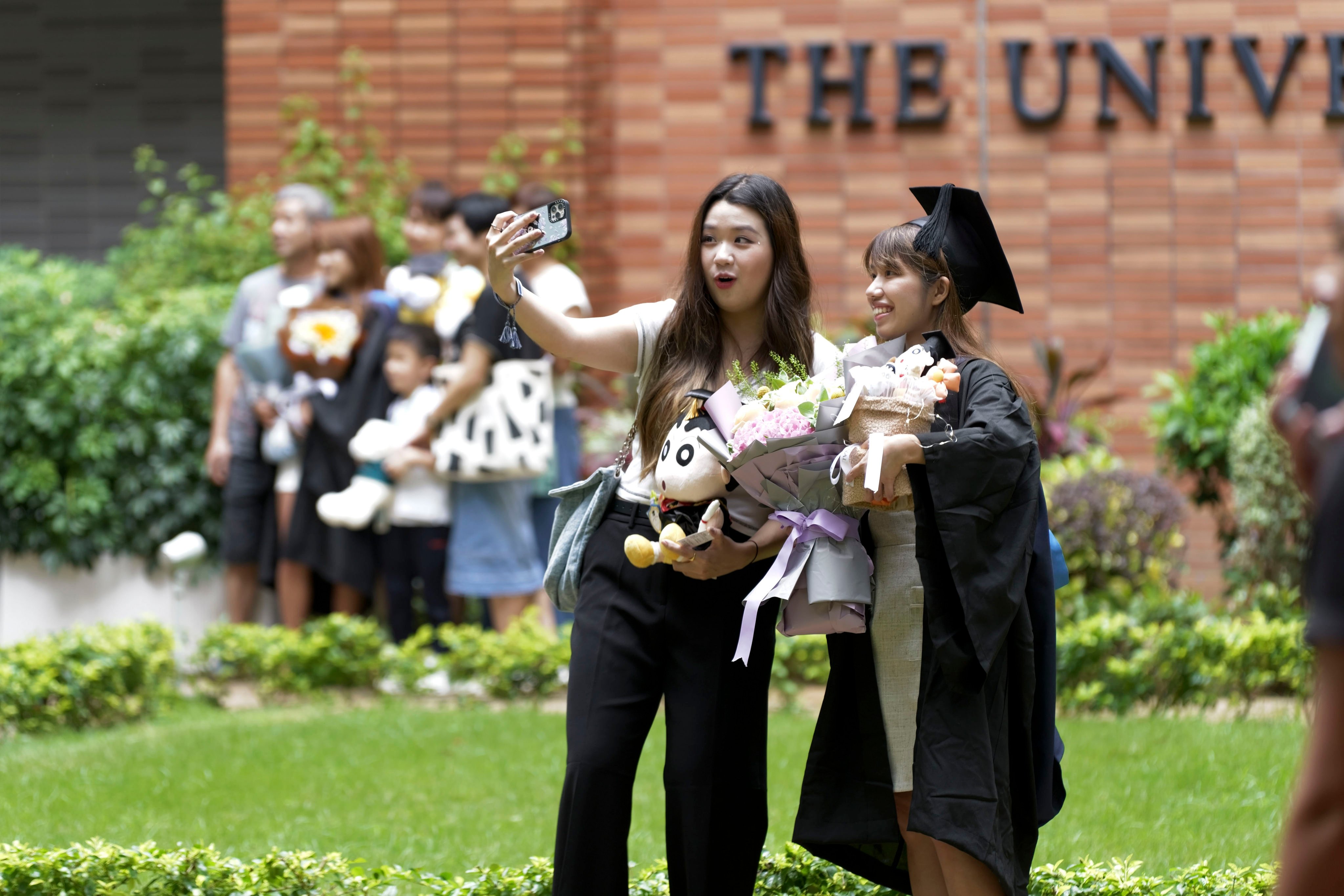 Students celebrate their graduation at the University of Hong Kong on August 2, 2024. Photo: Daniel Suen