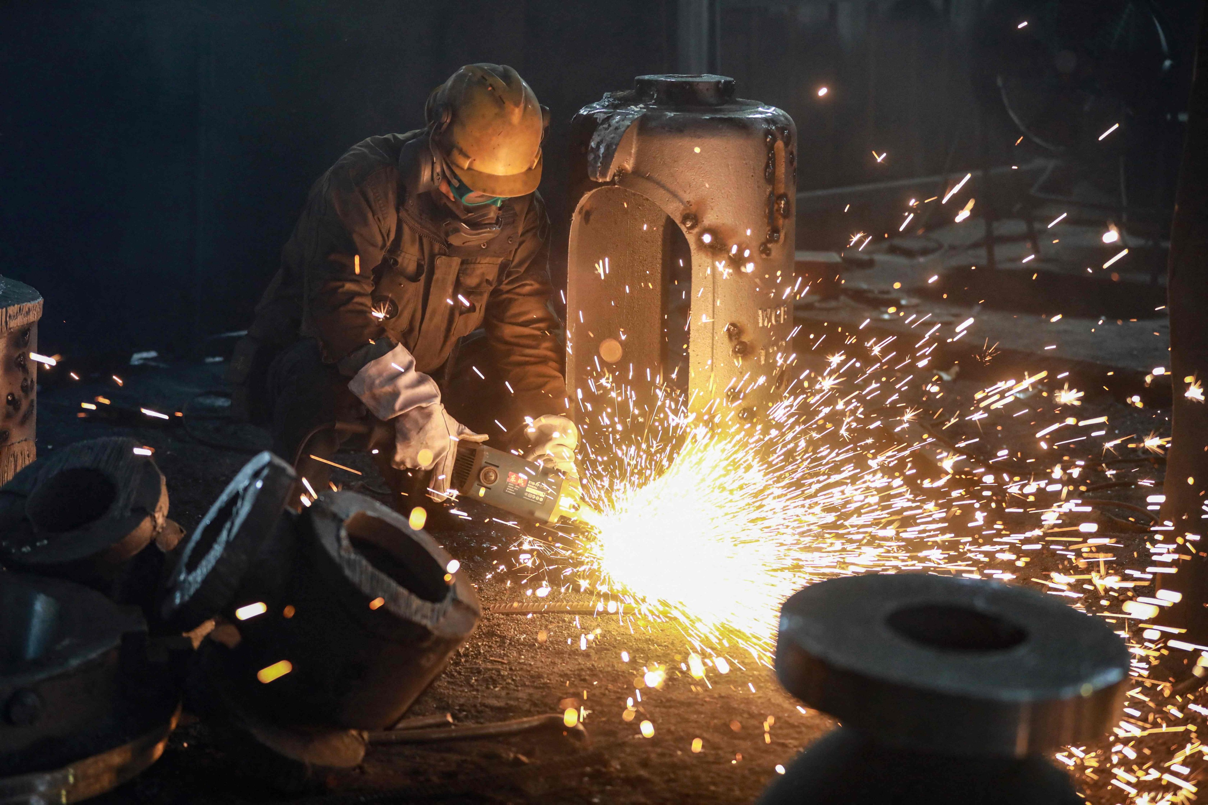 A worker casts steel at a factory in Hangzhou. China’s steel industry is struggling due to weak domestic demand and industry overcapacity. Photo: AFP