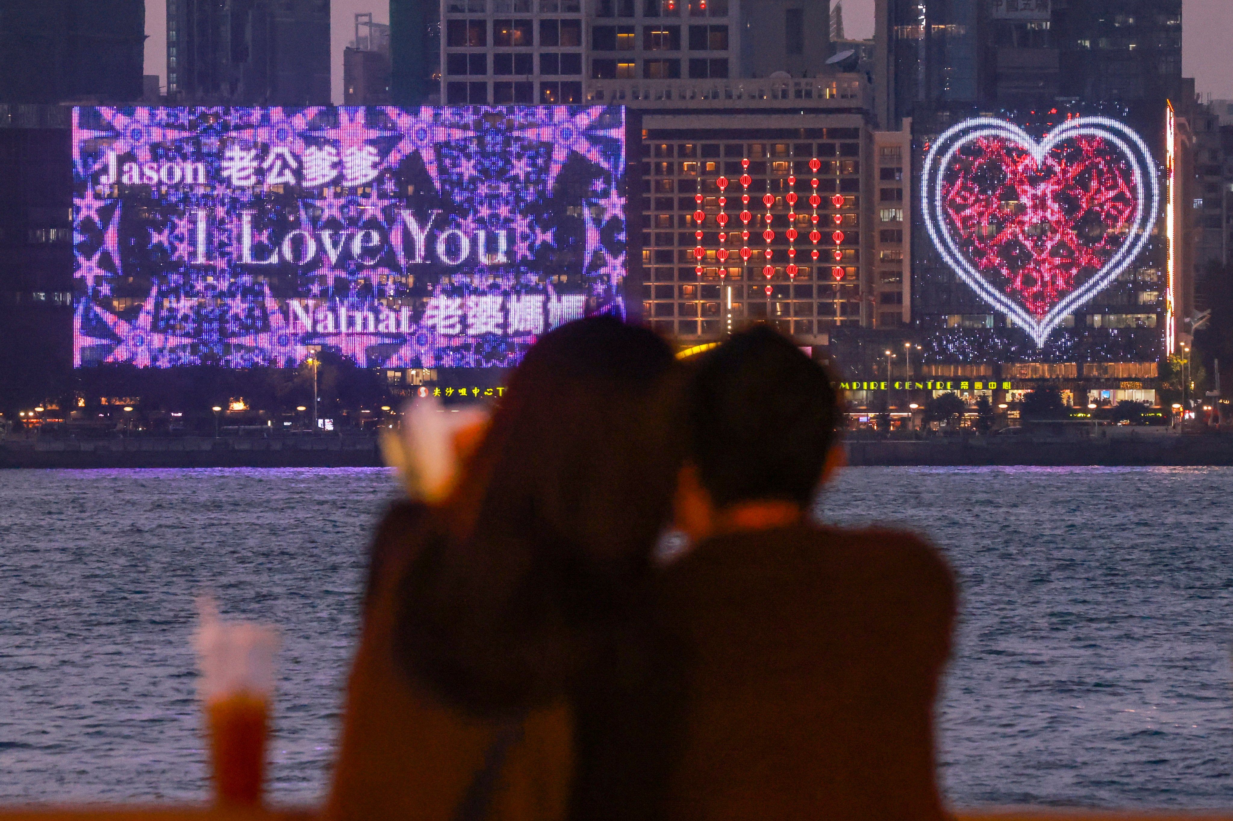 Love messages are displayed on an electronic billboard in Tsim Sha Tsui on February 14, 2024. In cities like Hong Kong, those three little words are seldom spoken in Chinese. Photo: May Tse