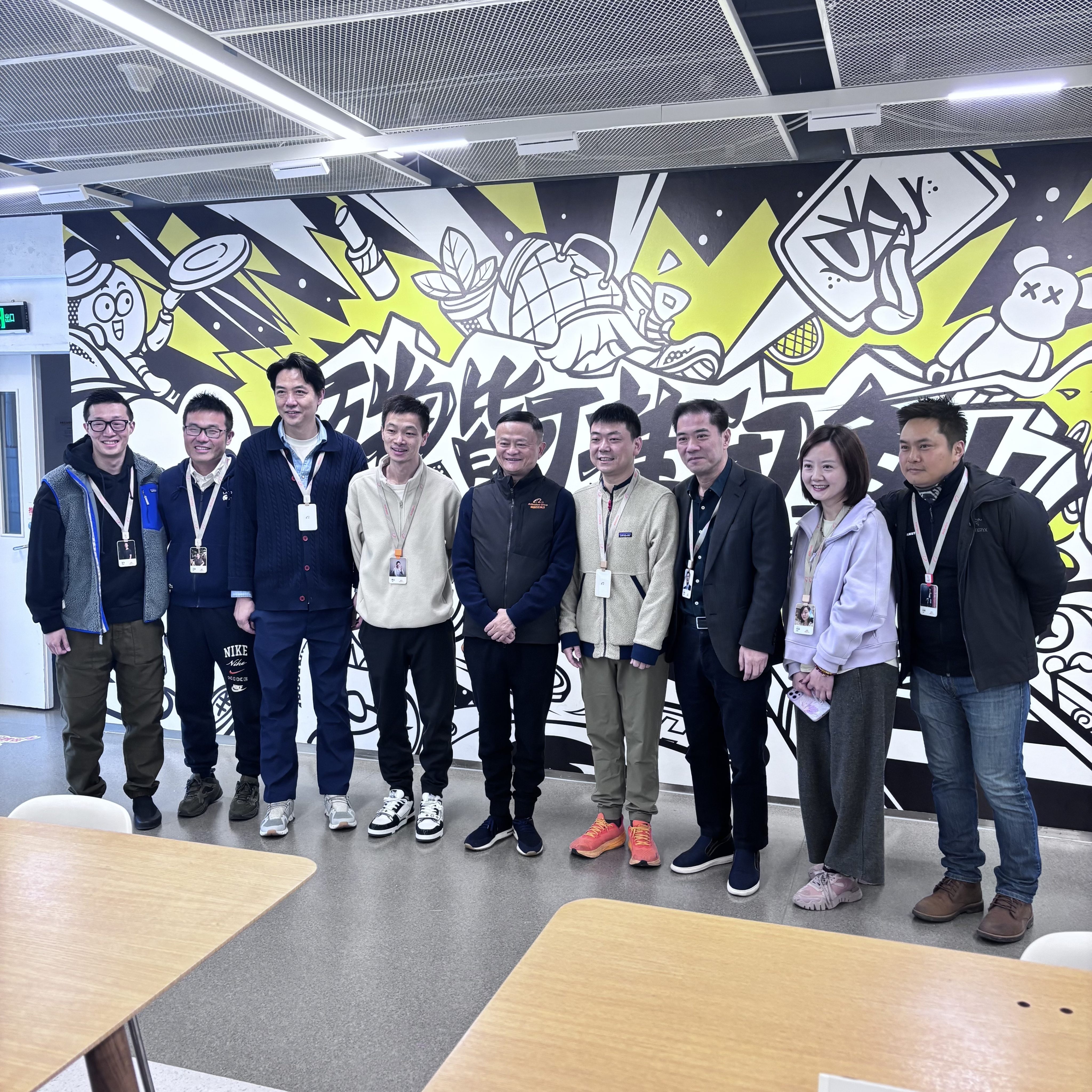 Alibaba founder Jack Ma (fifth from left) visits the offices of second-hand goods platform Xianyu in Hangzhou, capital of Zhejiang province, on Tuesday. Photo: Handout