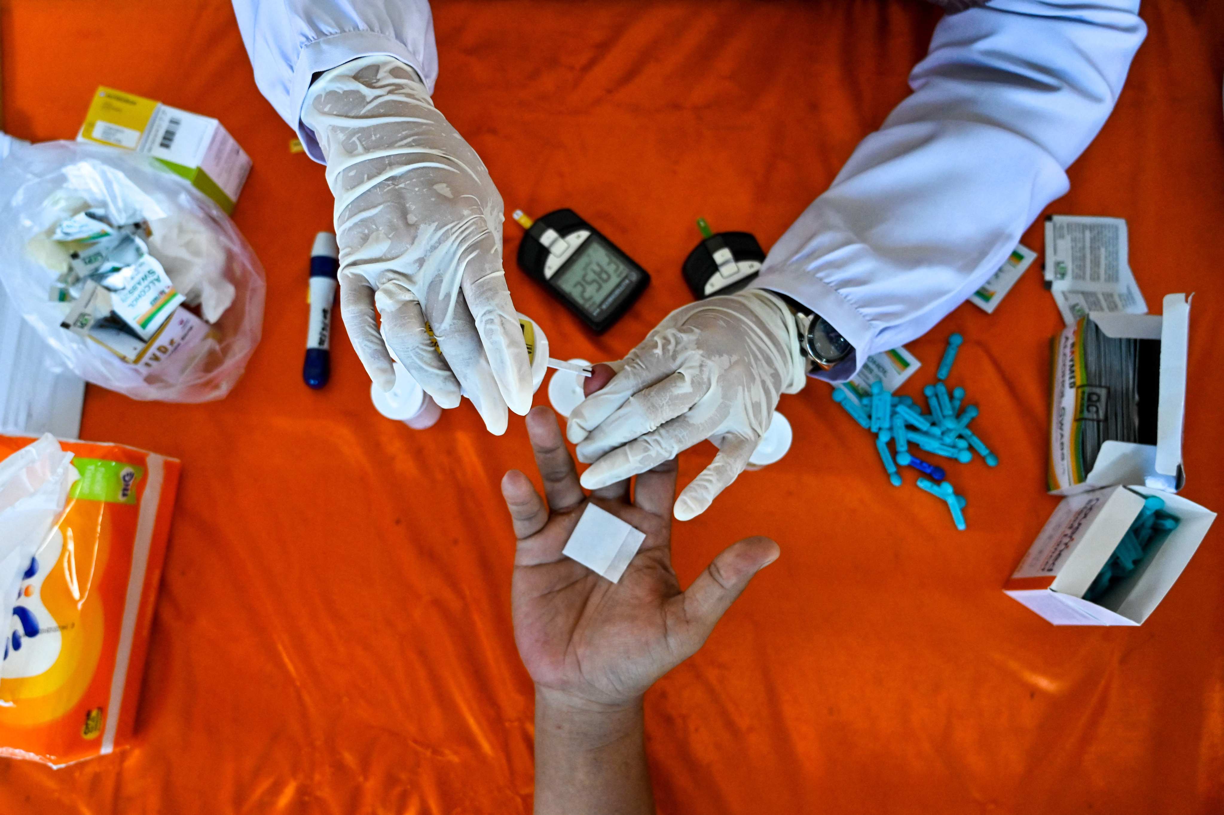 A man undergoes a medical check-up for hypertension, cholesterol and diabetes in Banda Aceh on Tuesday. Photo: AFP