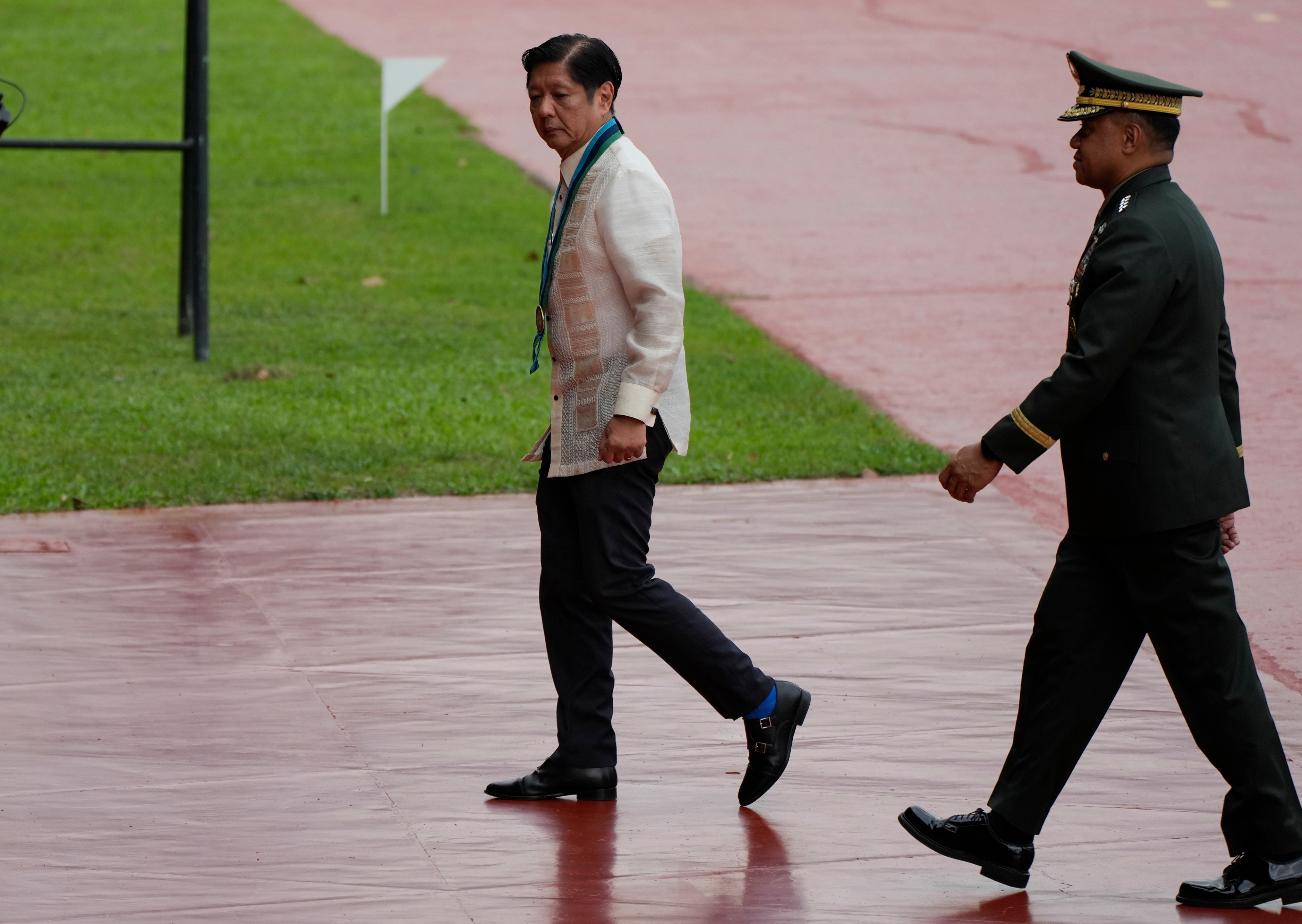 Philippine President Ferdinand Marcos Jnr is seen with military chief Romeo Brawner Jnr during the Armed Forces of the Philippines’ 89th anniversary in Quezon City, on December, 20, 2024. Photo: AP