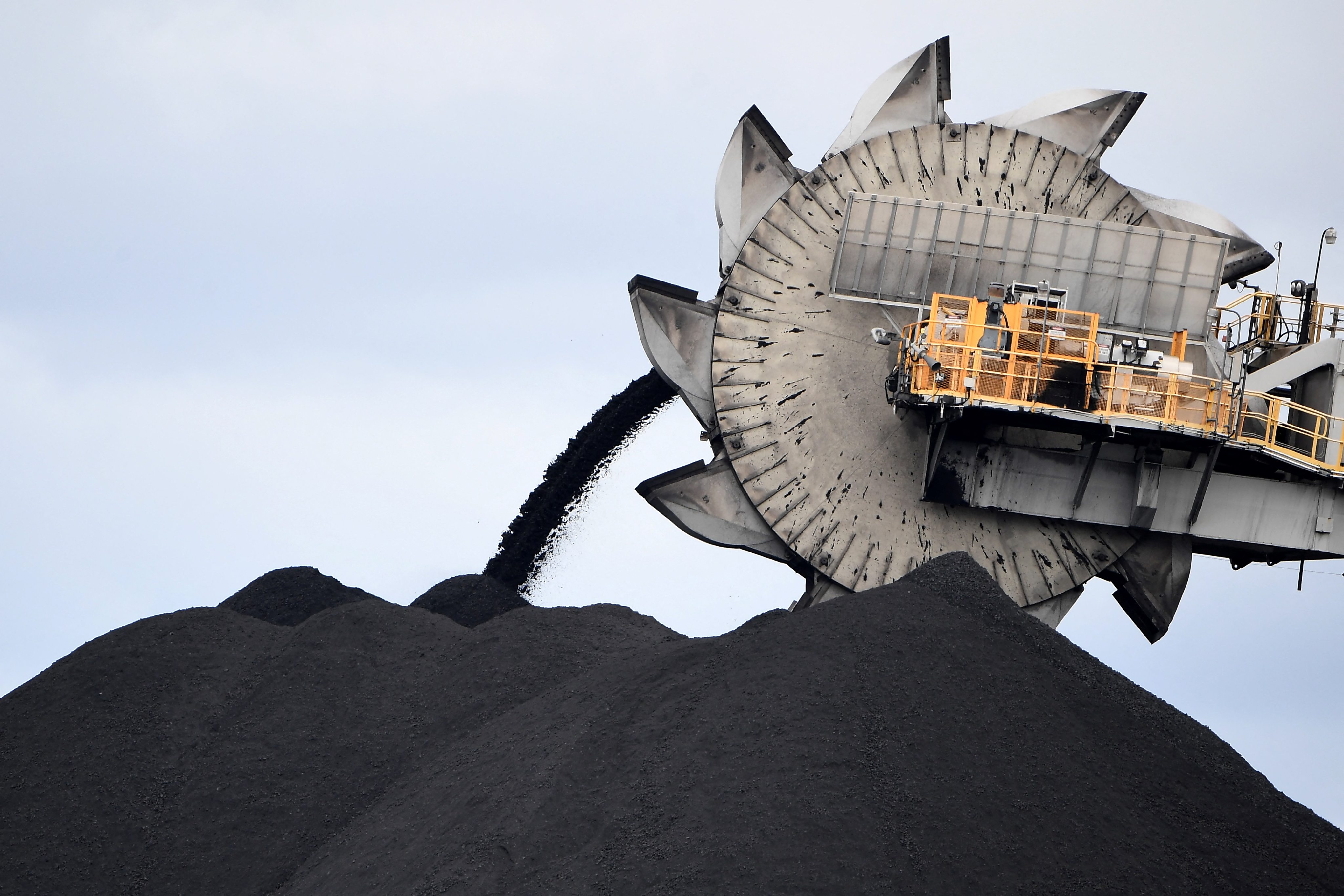 A bucket-wheel shifts earth at a mine in Newcastle, Australia. China and the US are both major investors in Australia’s minerals sector. Photo: AFP