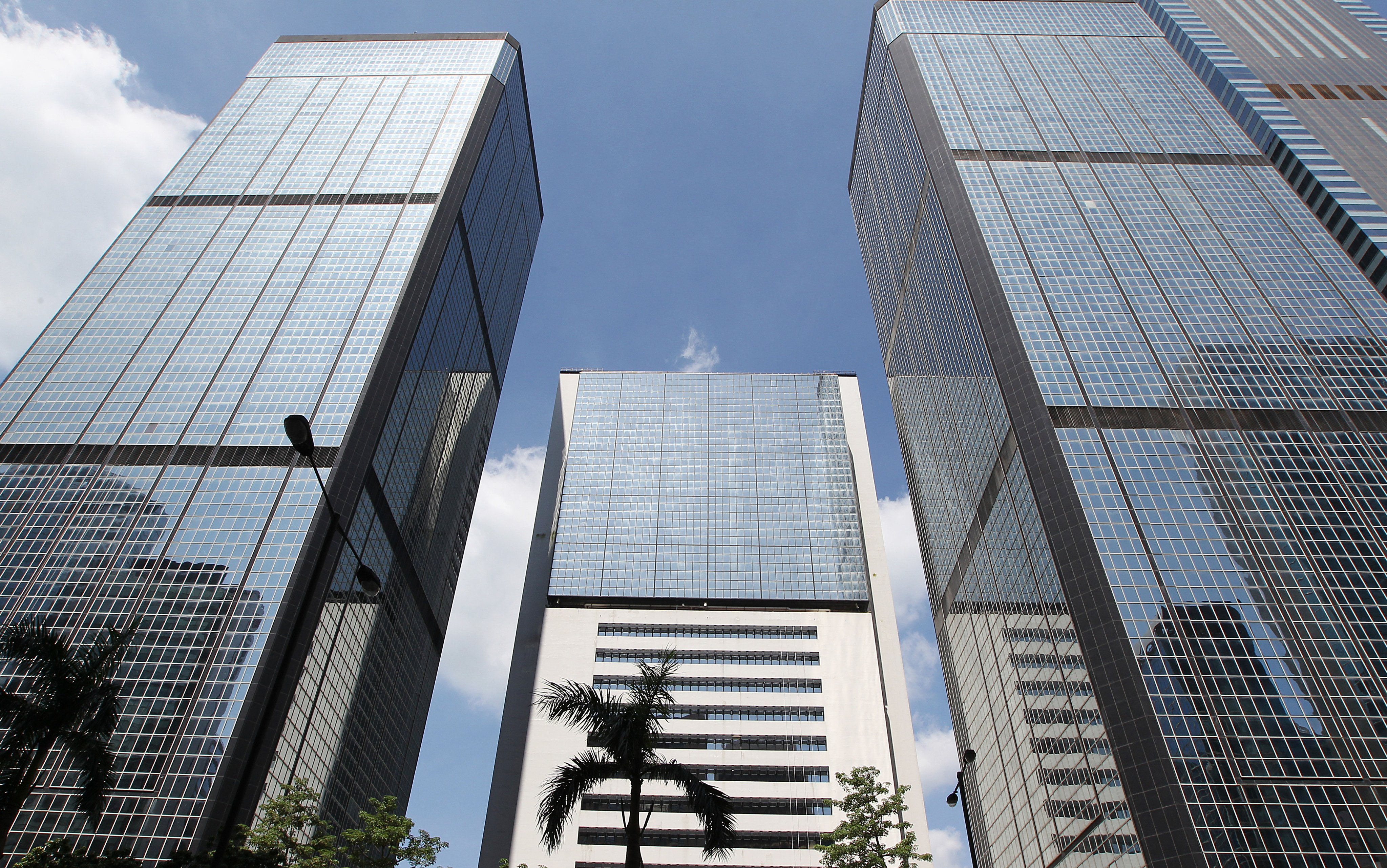 (From left) Revenue Tower, Wanchai Tower and Immigration Tower have been earmarked for redevelopment into a complex connected to the Convention and Exhibition Centre. Photo: Roy Issa