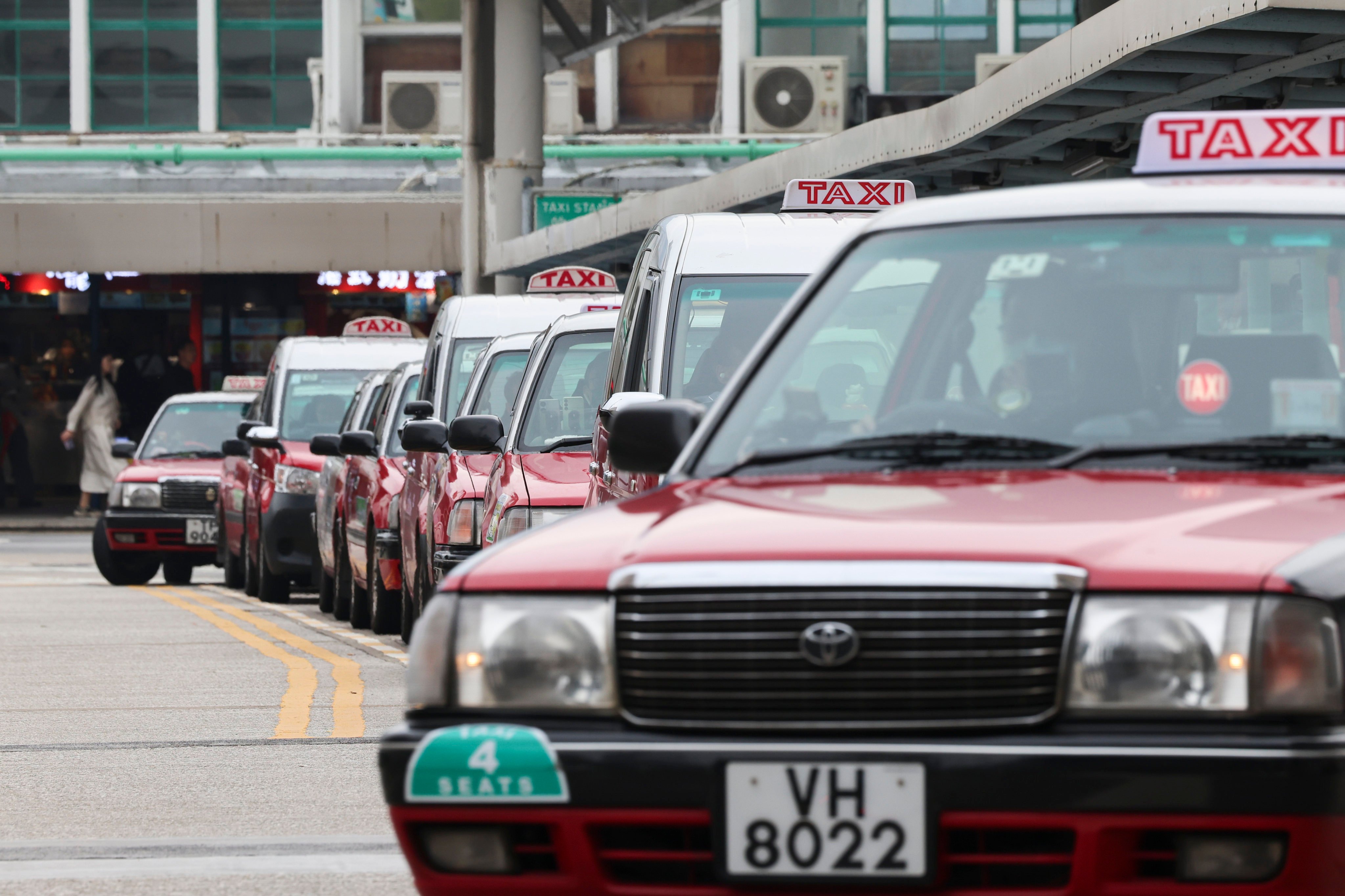 Taxis in a queue outside Tsim Sha Tsui Pier. On Tuesday night, the Hong Kong Tele-call Taxi Association held a meeting at which 80 per cent of attendees, representing 30,000 drivers, agreed to strike if authorities did not respond to its demands. Photo: Jelly Tse