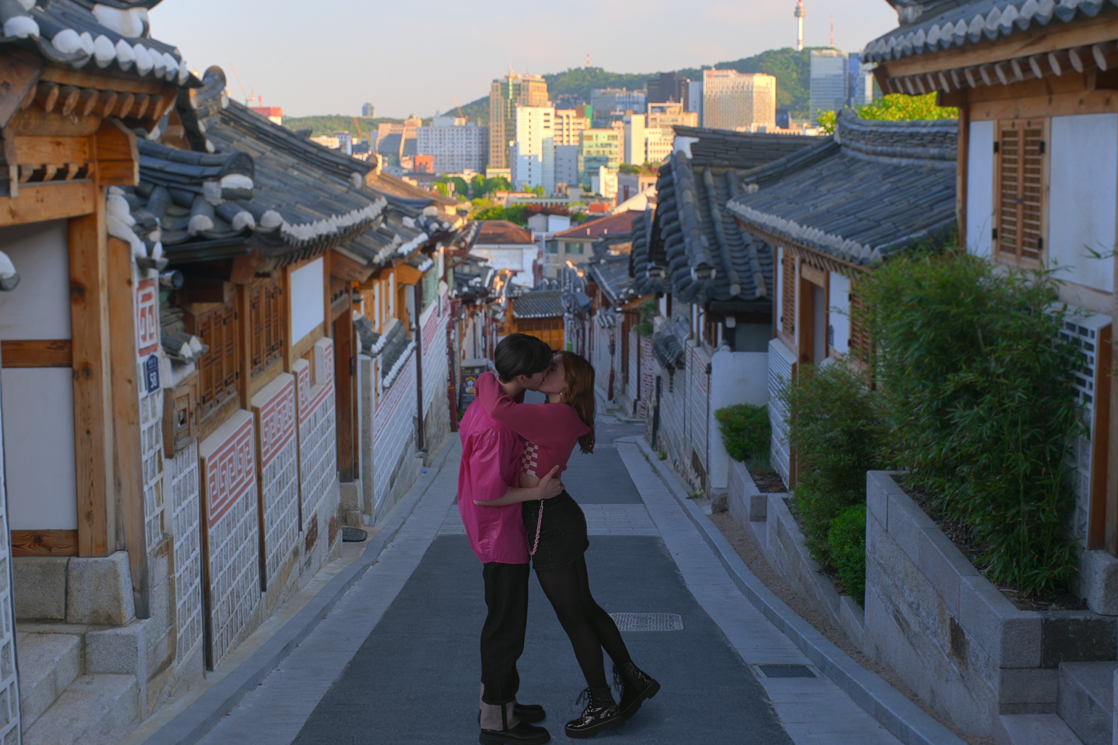 Sang Heon Lee and Jocelyn Shelfo in a still from XO, Kitty, which used locations in South Korea for filming. Photo: courtesy of Netflix