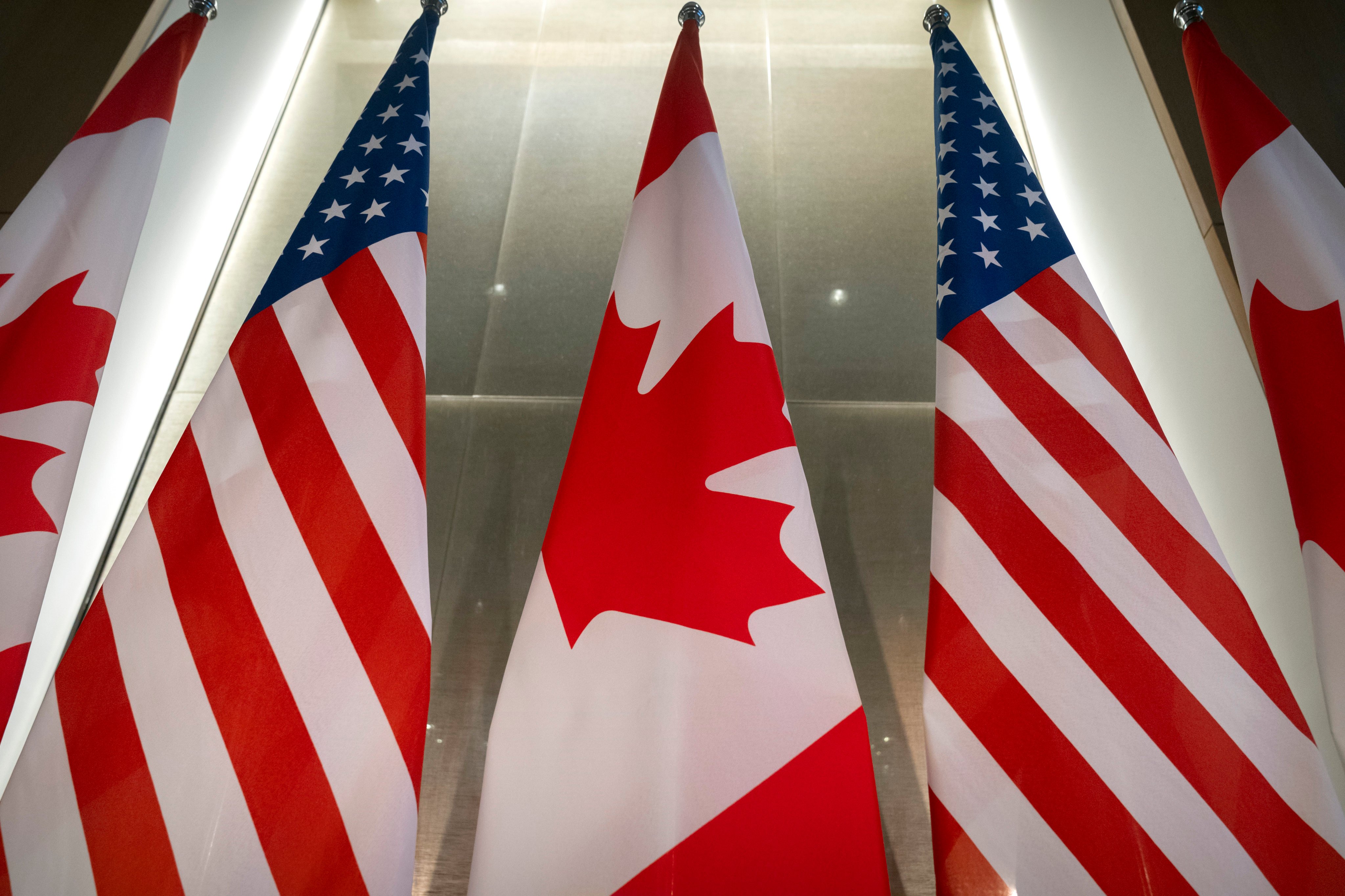 US and Canadian flags are displayed before an event with Ontario Premier Doug Ford and the US Chamber of Commerce in Washington on Tuesday. Photo: AP