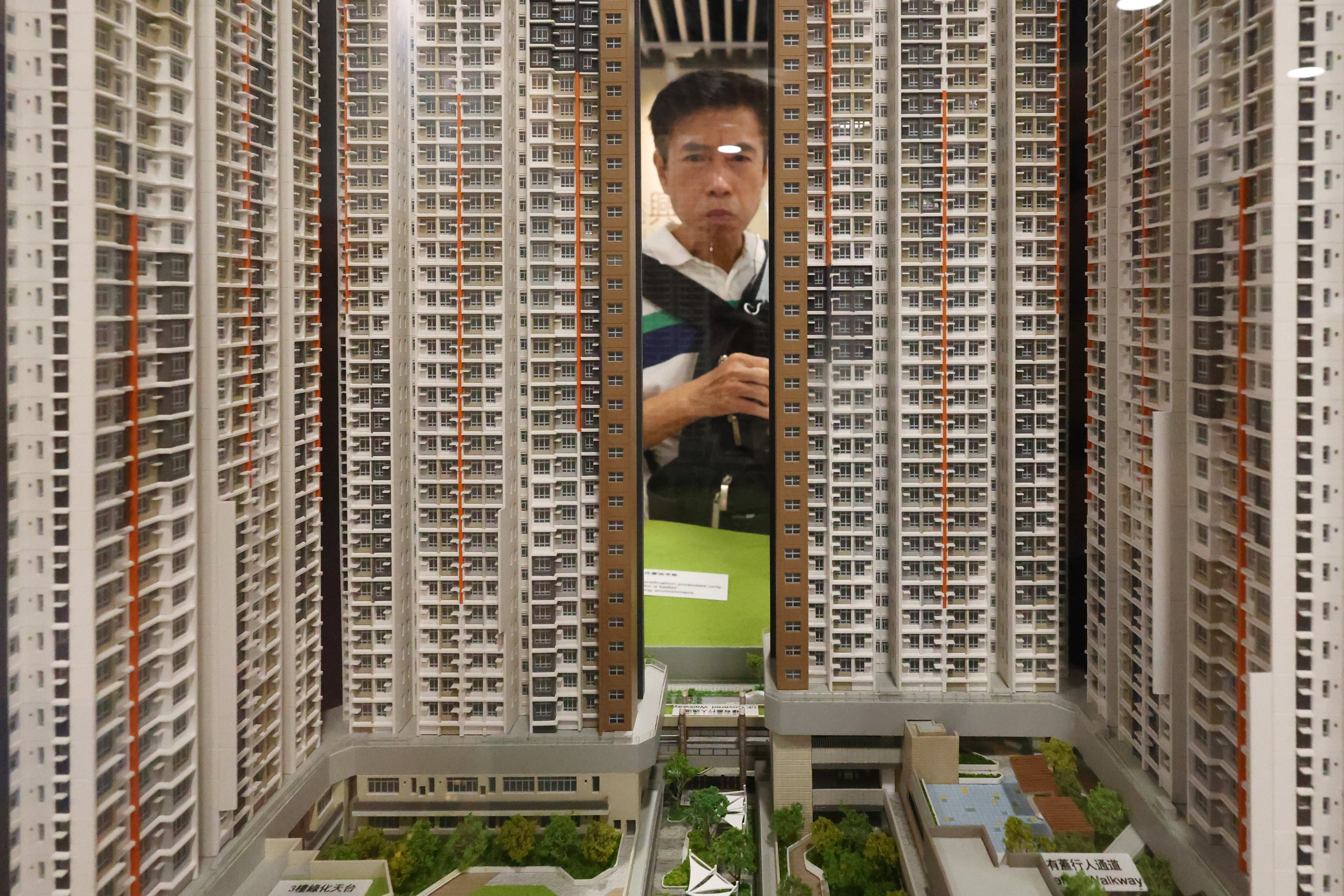 A man looks at a model of a Home Ownership Scheme estate at the Housing Authority’s premises in Lok Fu on October 23, 2024. Photo: Dickson Lee