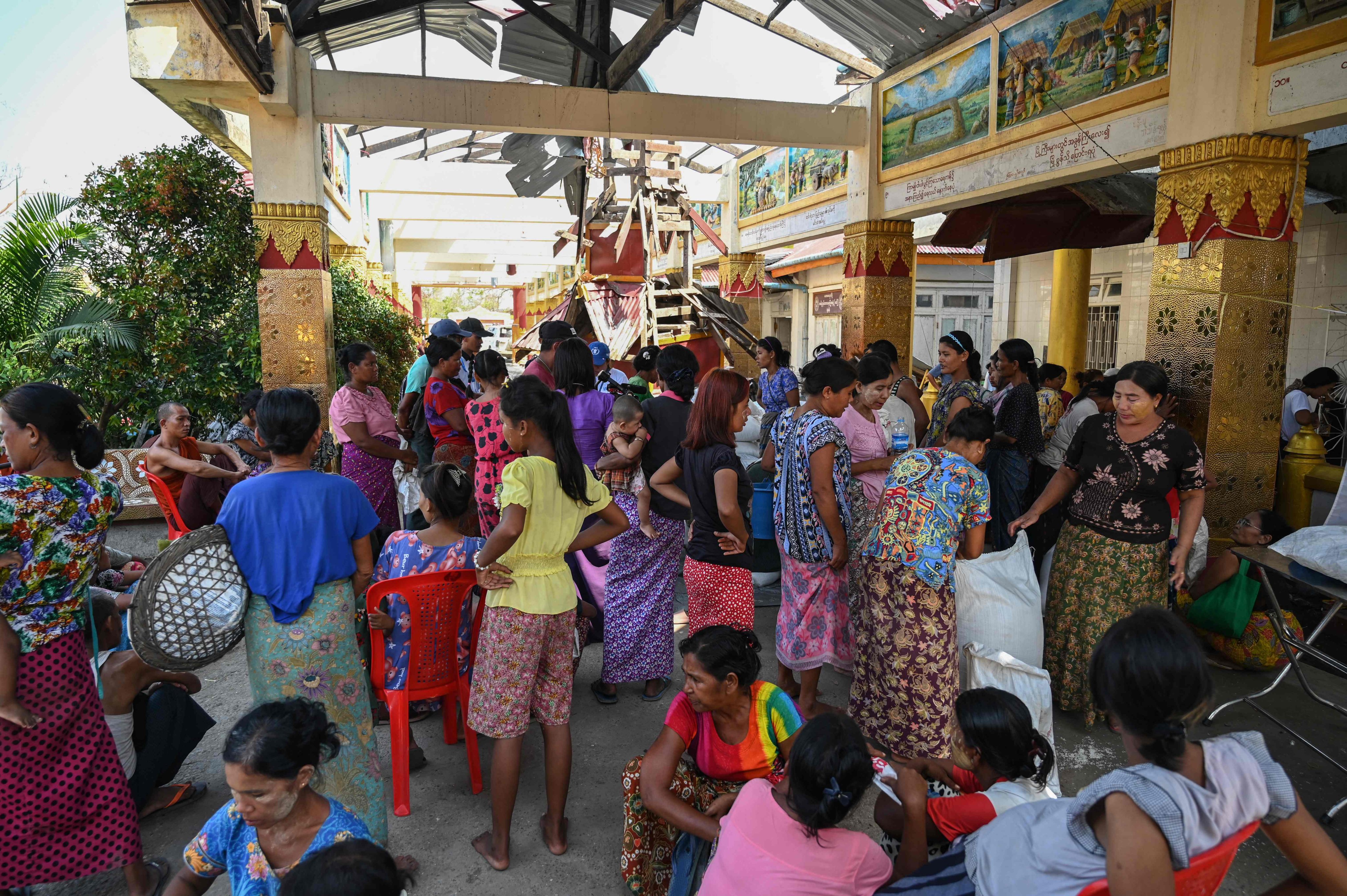 People wait for food donations at a monastery in Sittwe, Myanmar, in 2023. Photo: AFP