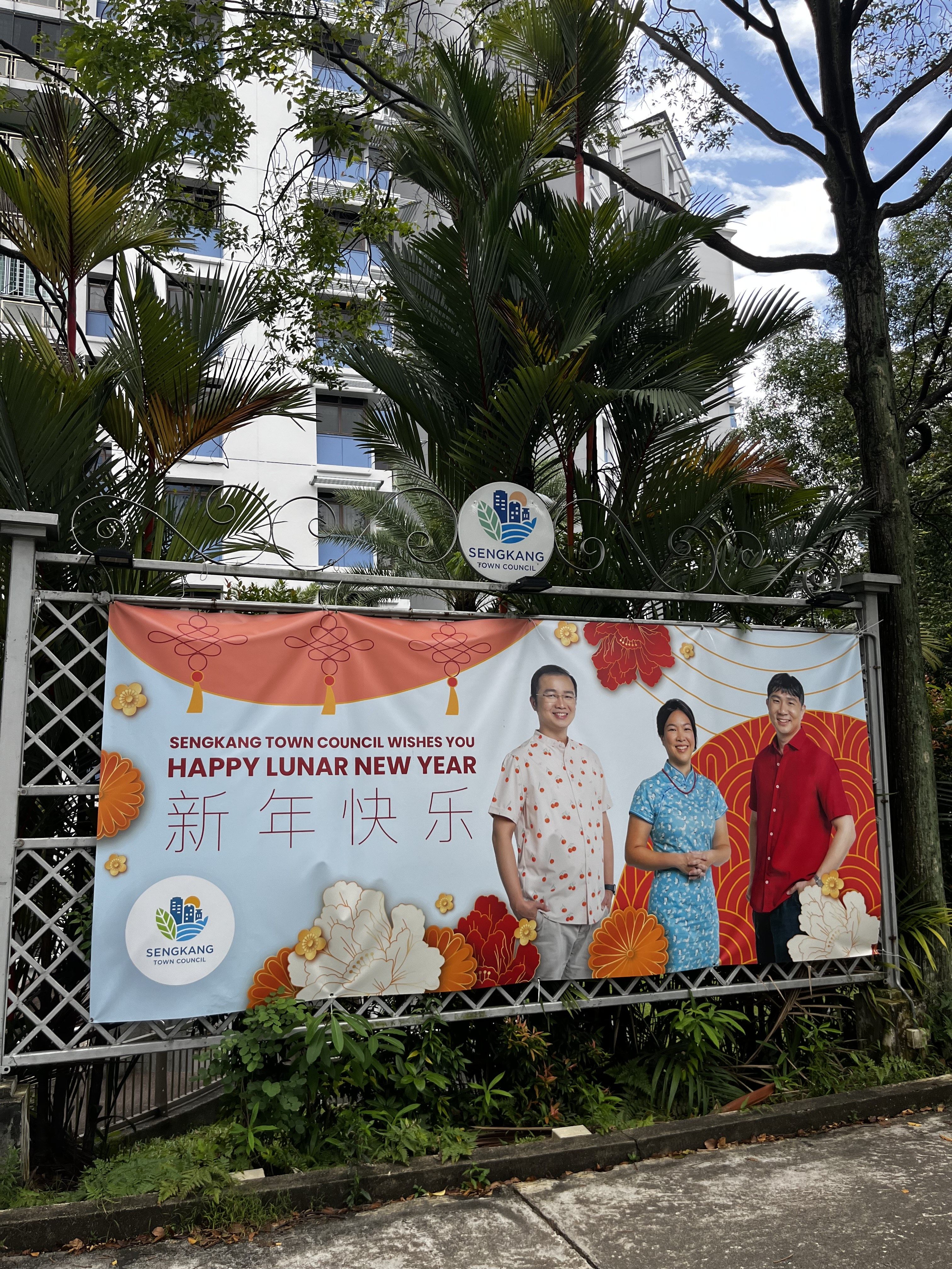 Workers’ Party MPs Louis Chua, He Ting Ru and Jamus Lim pictured on a Lunar New Year banner in Sengkang, Singapore. Photo: Jean Iau