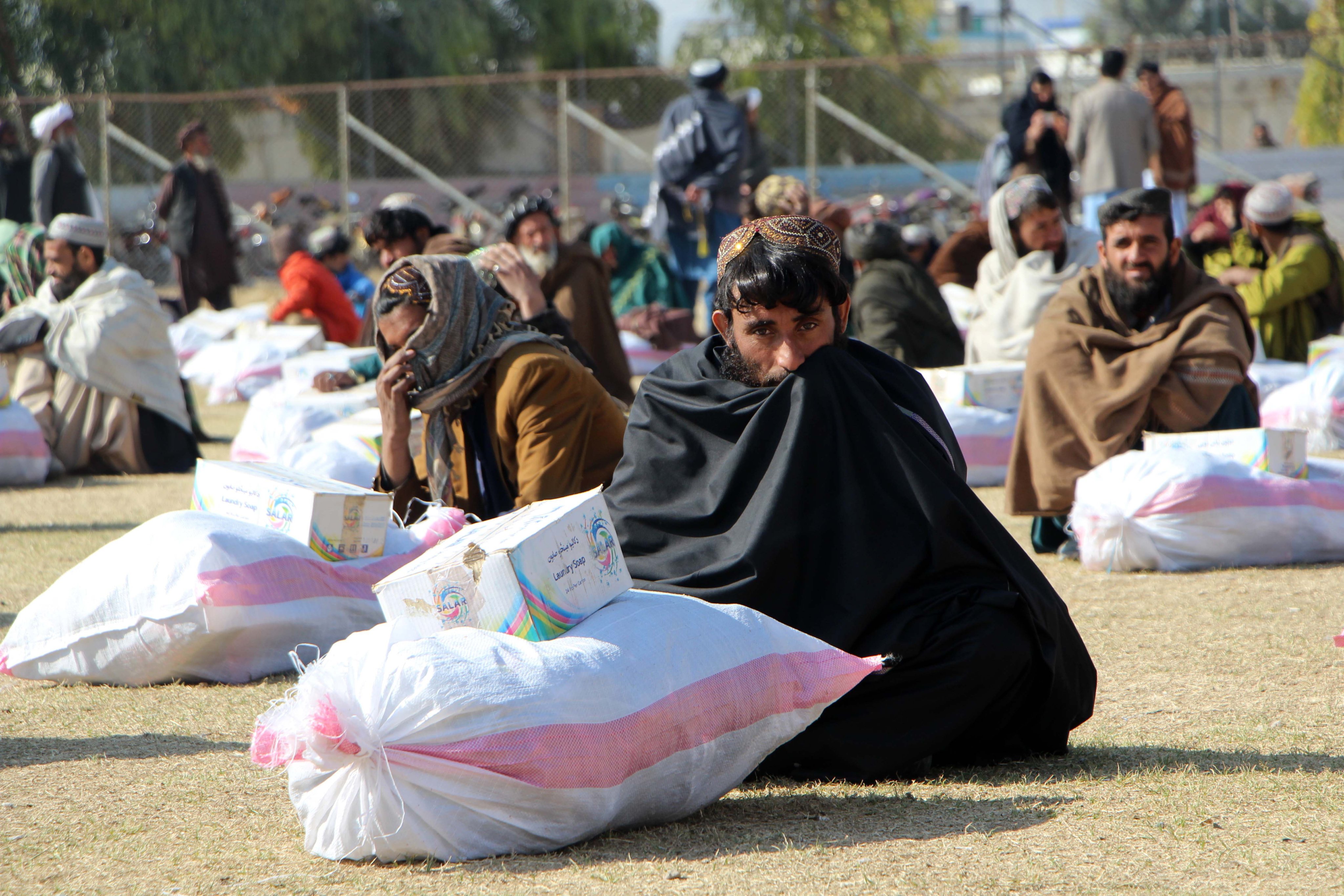 Afghans receive rations distributed by a charity organisation in Kandahar last month, as Afghanistan grapples with severe food shortages. Photo: EPA-EFE