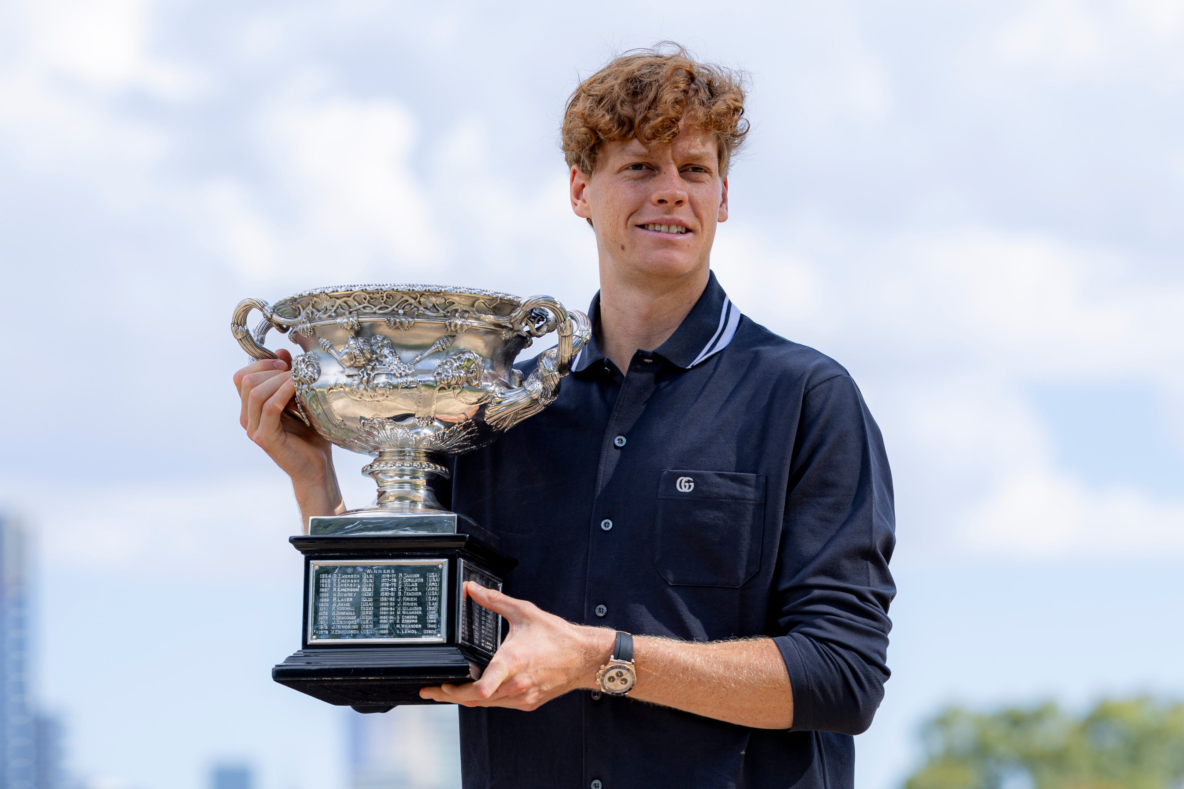 Jannik Sinner poses with the Australian Open trophy that he won last month. Photo: Xinhua
