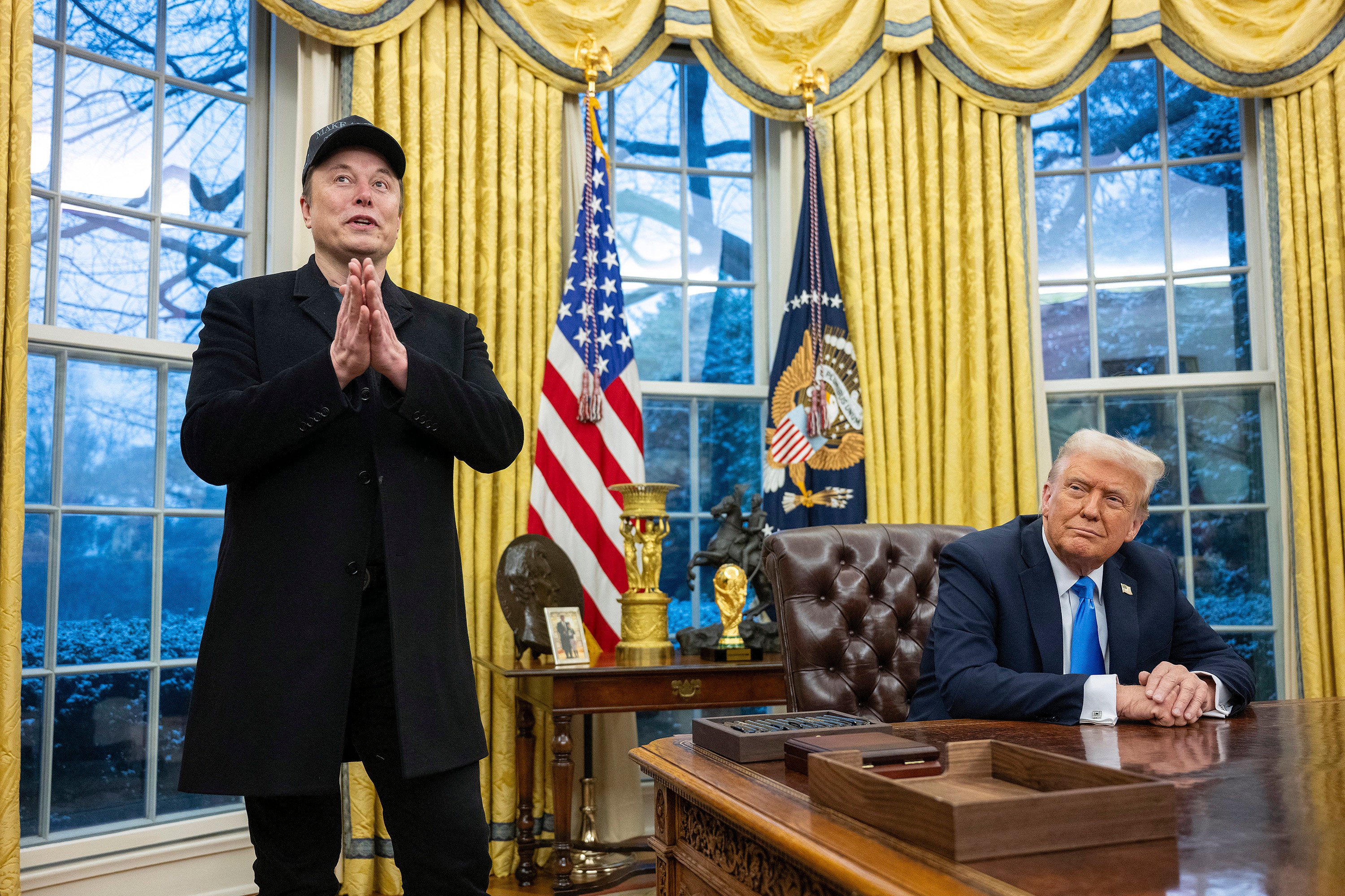 Elon Musk speaks as US President Donald Trump looks on in the Oval Office on Tuesday. Photo: TNS