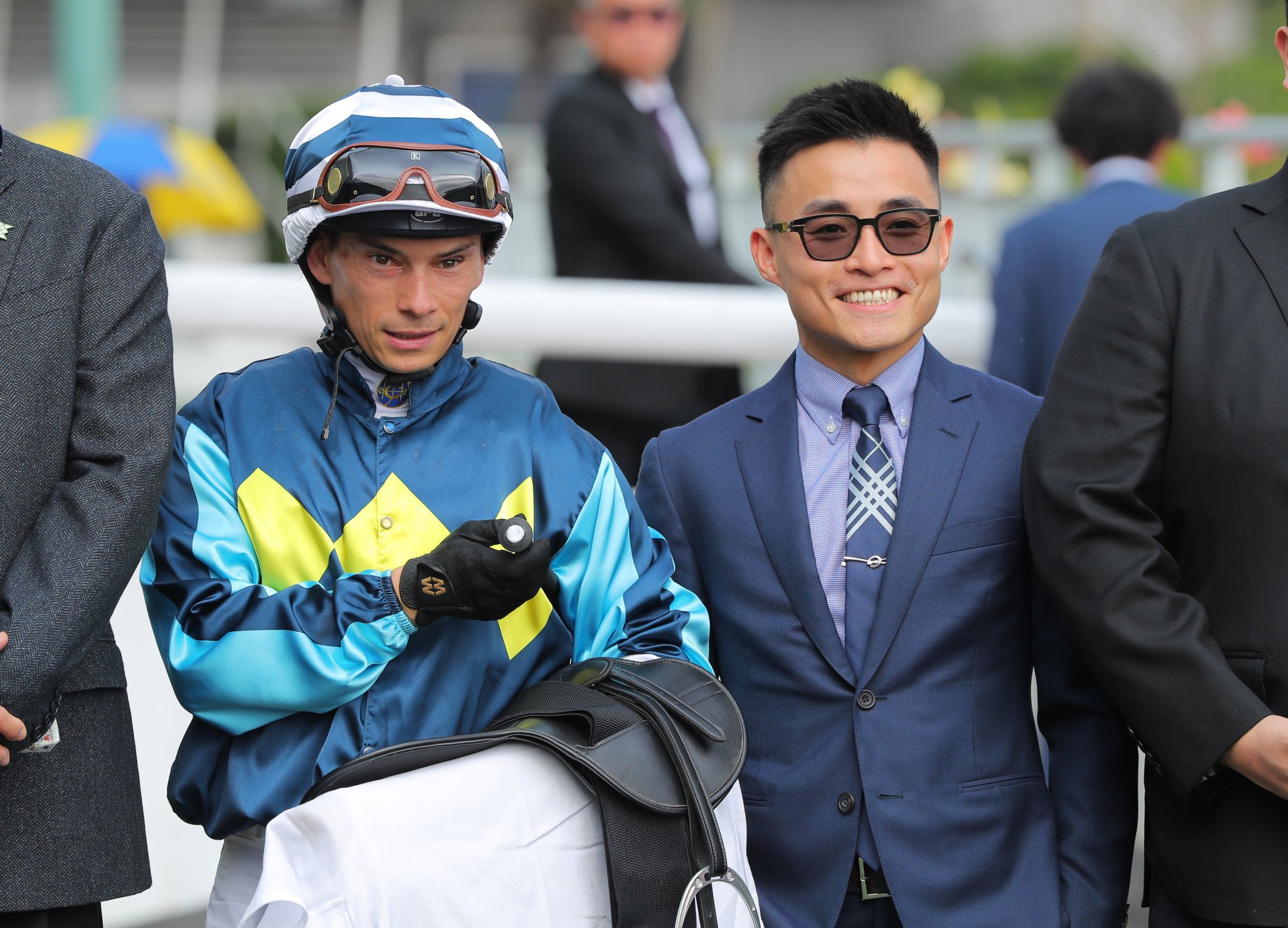 Jockeys Alexis Badel (left) and Keith Yeung enjoy Master For All’s win.