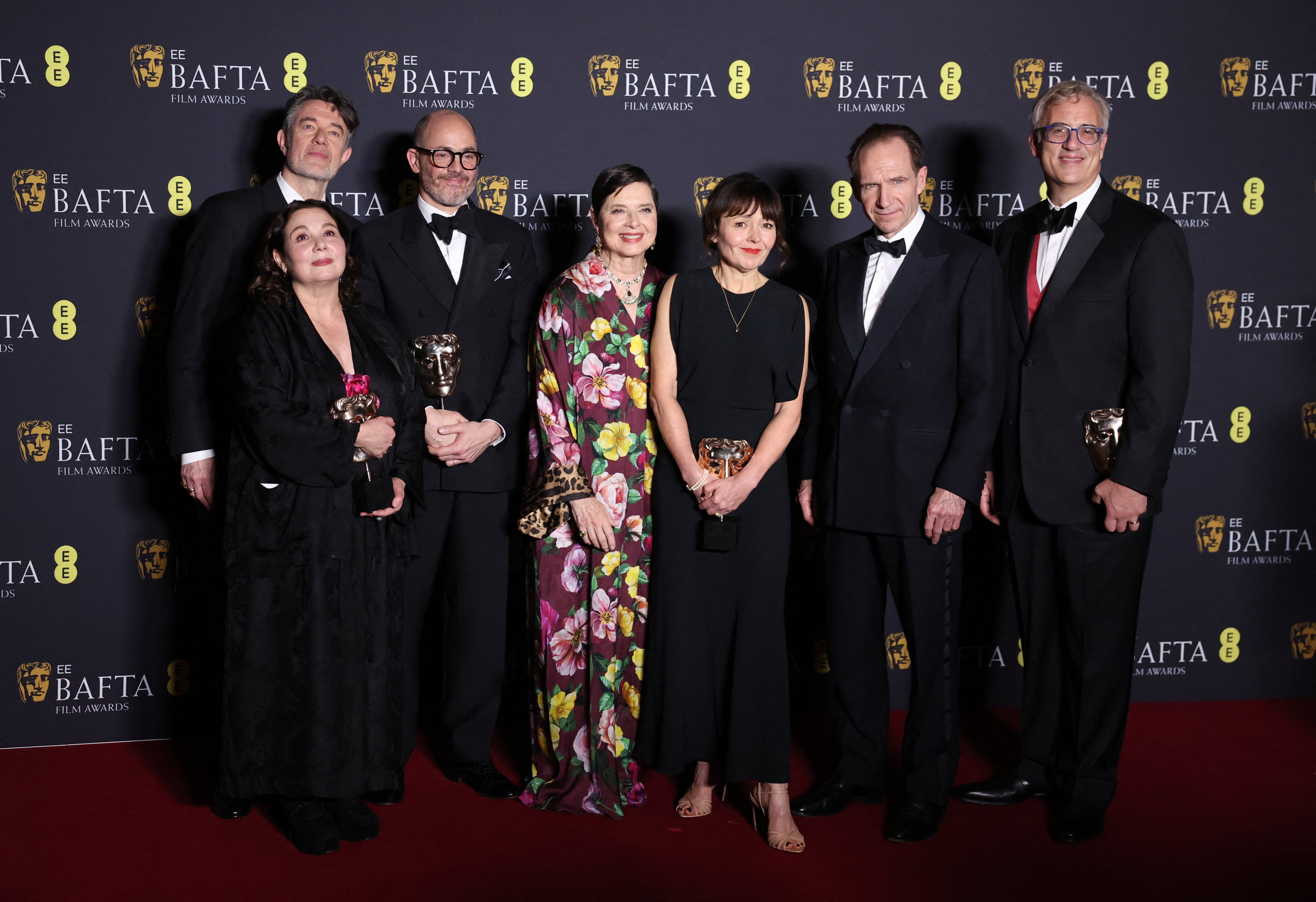 From left, Peter Straughan, Tessa Ross, Edward Berger, Isabella Rossellini, Juliette Howell, Ralph Fiennes and Michael A Jackman in the winners’ room after Conclave won the award for Best Film during the Baftas at the Royal Festival Hall in London on Sunday. Photo: Reuters