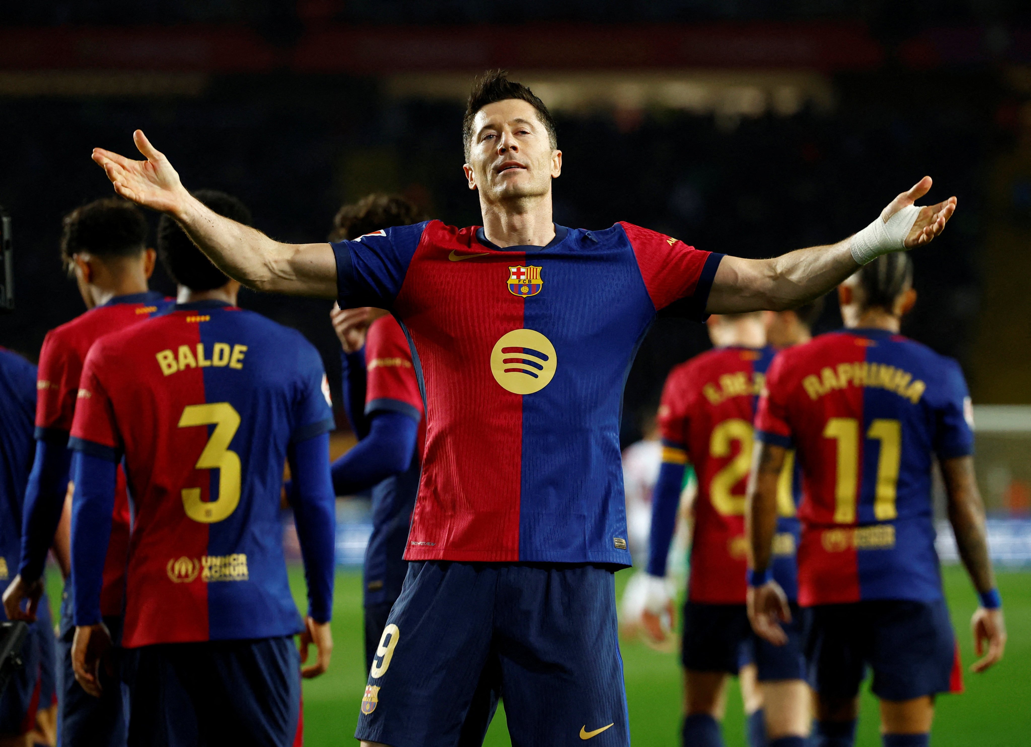 Barcelona’s Robert Lewandowski celebrates after his match-winning penalty against Rayo Vallecano. Photo: Reuters