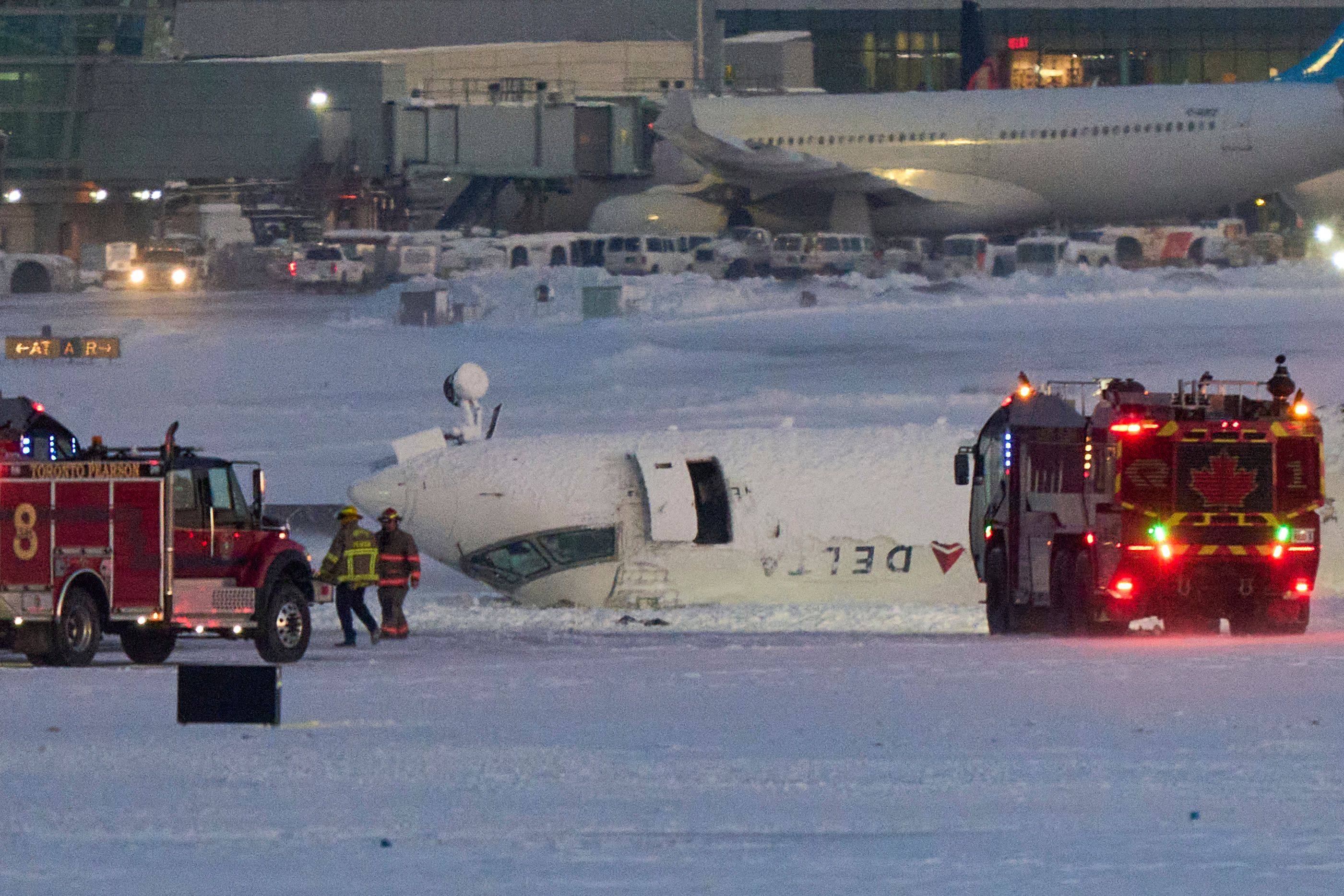 The plane flipped onto its roof on the runway. Photo: AFP