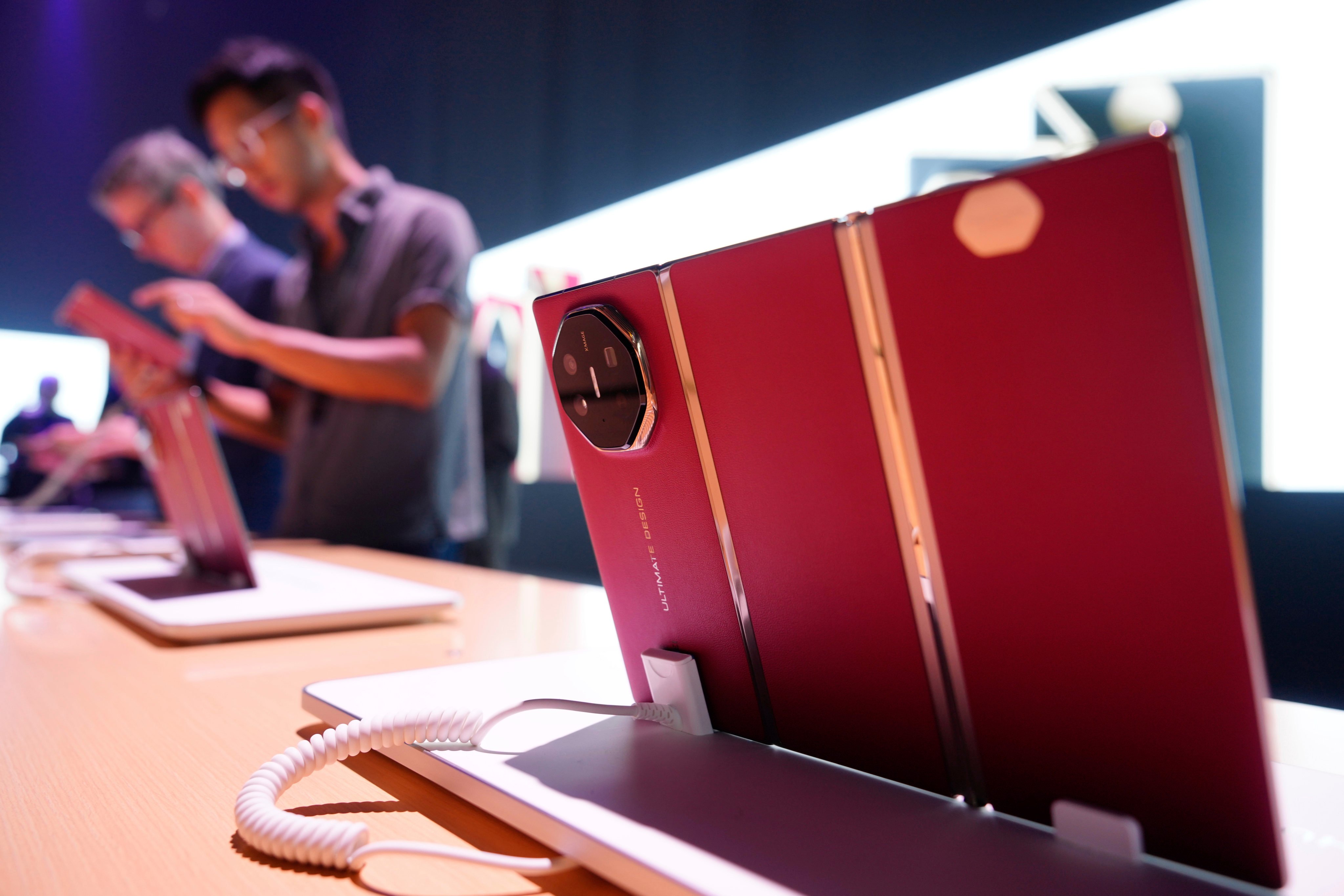 Visitors check out the Mate XT trifold smartphone on the sidelines of Huawei Technologies’ global roll-out of the handset in Kuala Lumpur, Malaysia, on Tuesday. Photo: AP