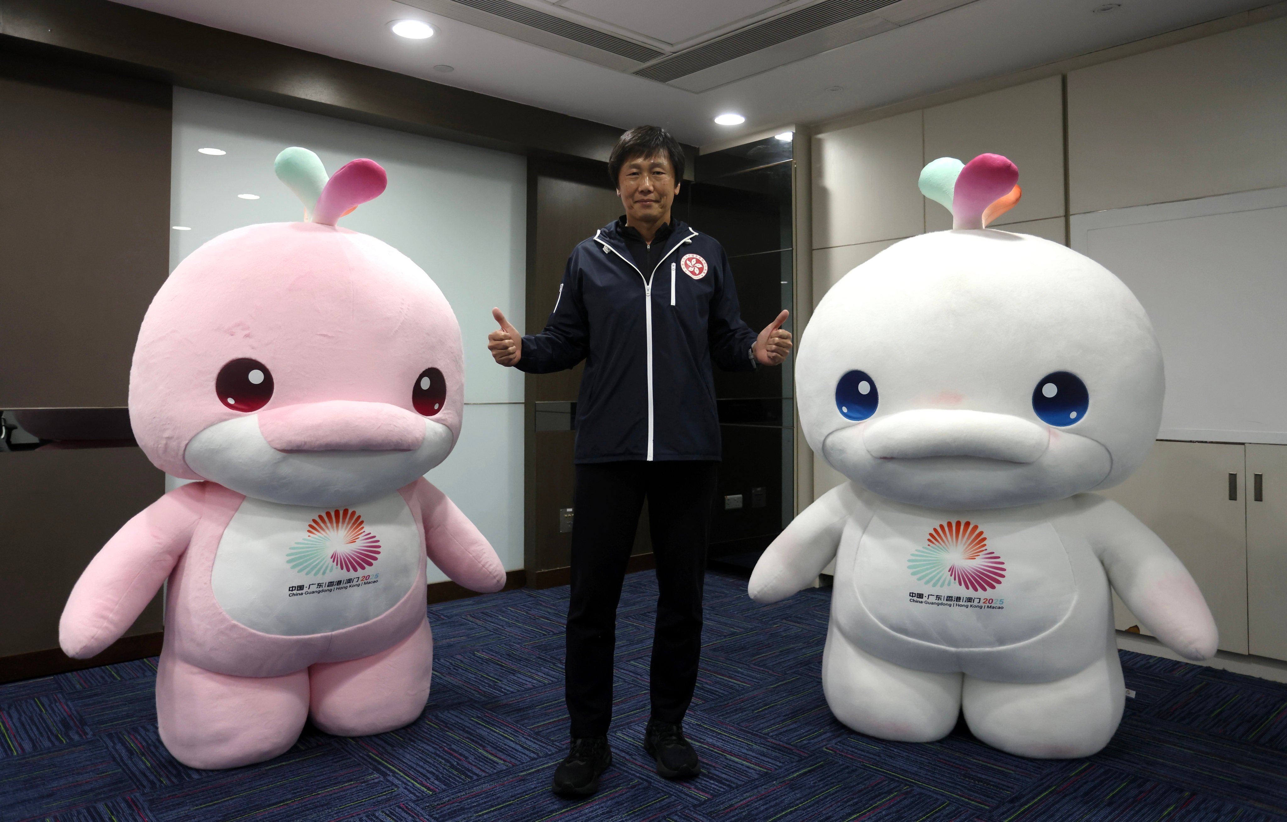 Yeung Tak-keung, head of the National Games Coordination Office, with Games mascots Lerongrong (left) and Xiyangyang at his offices in Wan Chai. Photo: Jonathan Wong