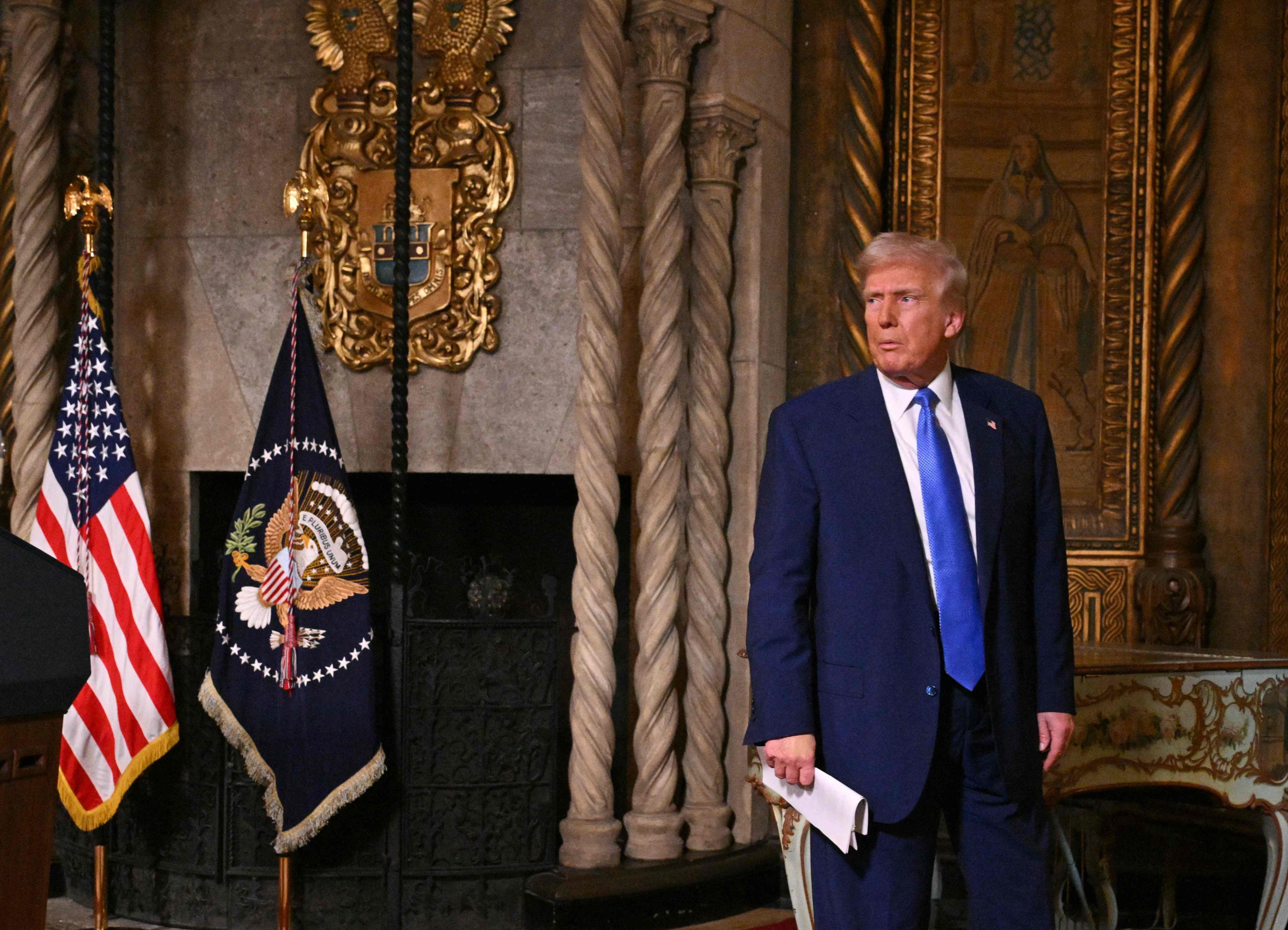 US President Donald Trump leaves after speaking to the media at his Mar-a-Lago resort in Florida on Tuesday. Photo: AFP