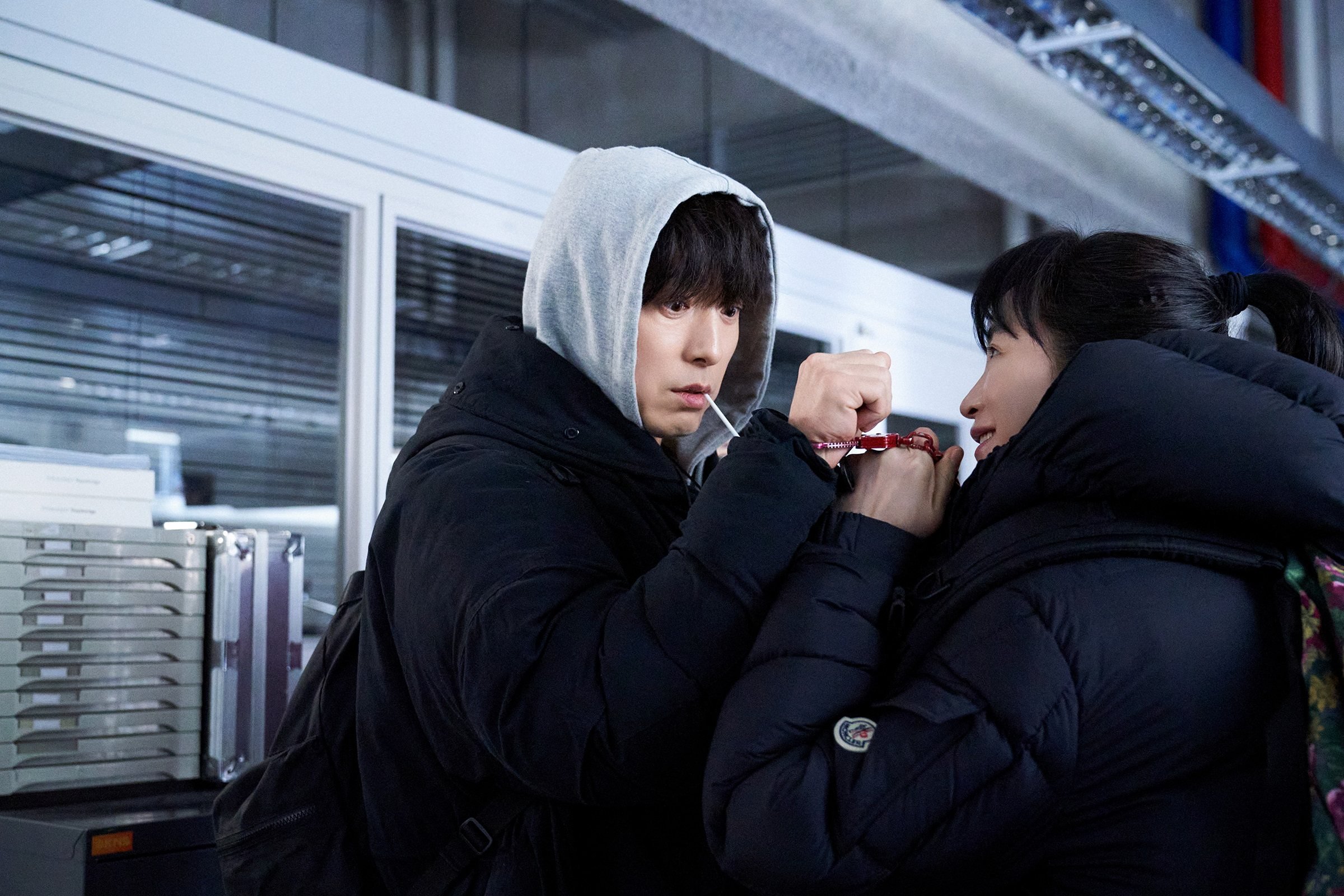 Jung Sung-il (left) and Kim Hye-soo in a still from the Disney+ thriller series Unmasked.