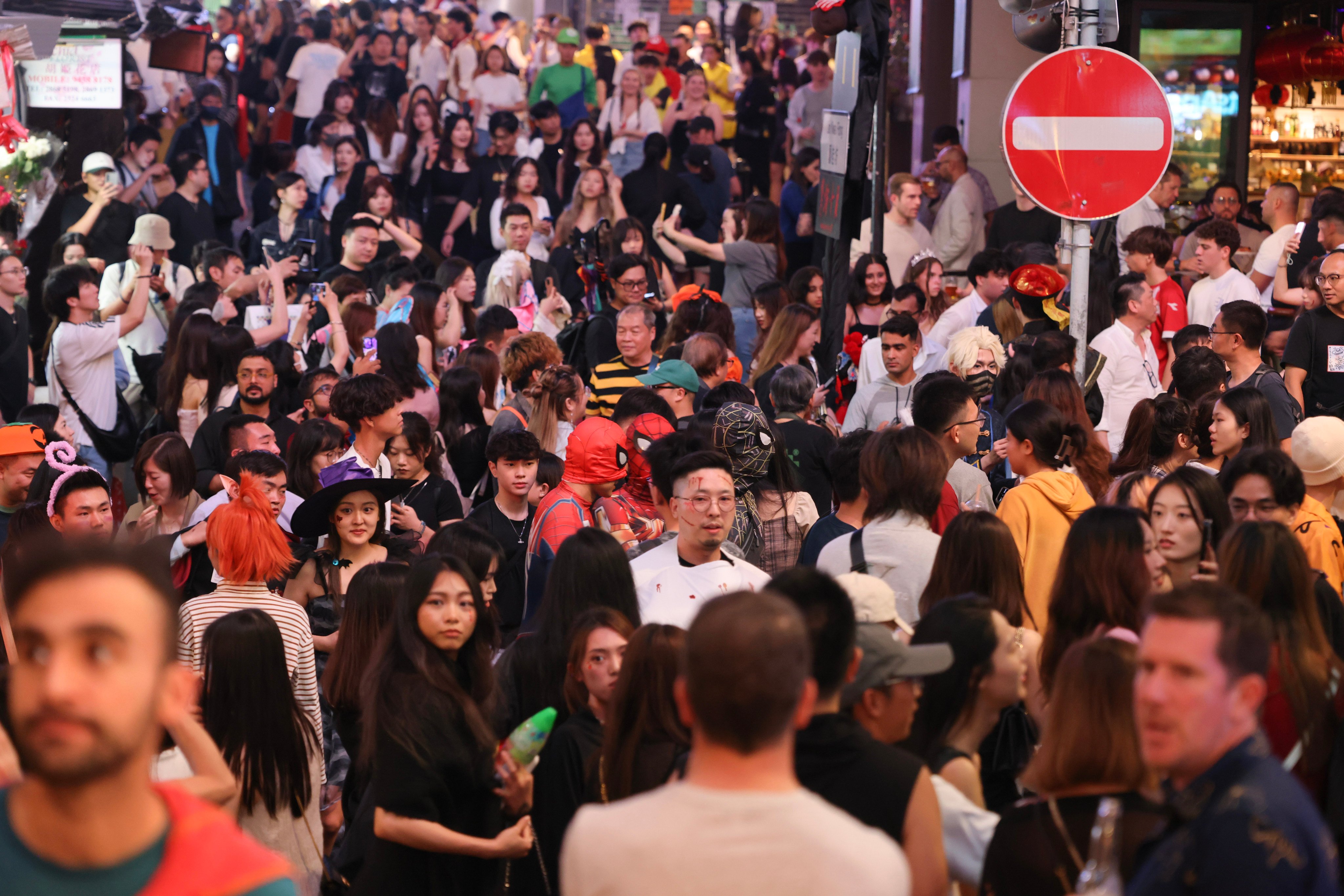 Halloween revellers pack Hong Kong’s party zone, Lan Kwai Fong, on October 26. Photo: Nora Tam