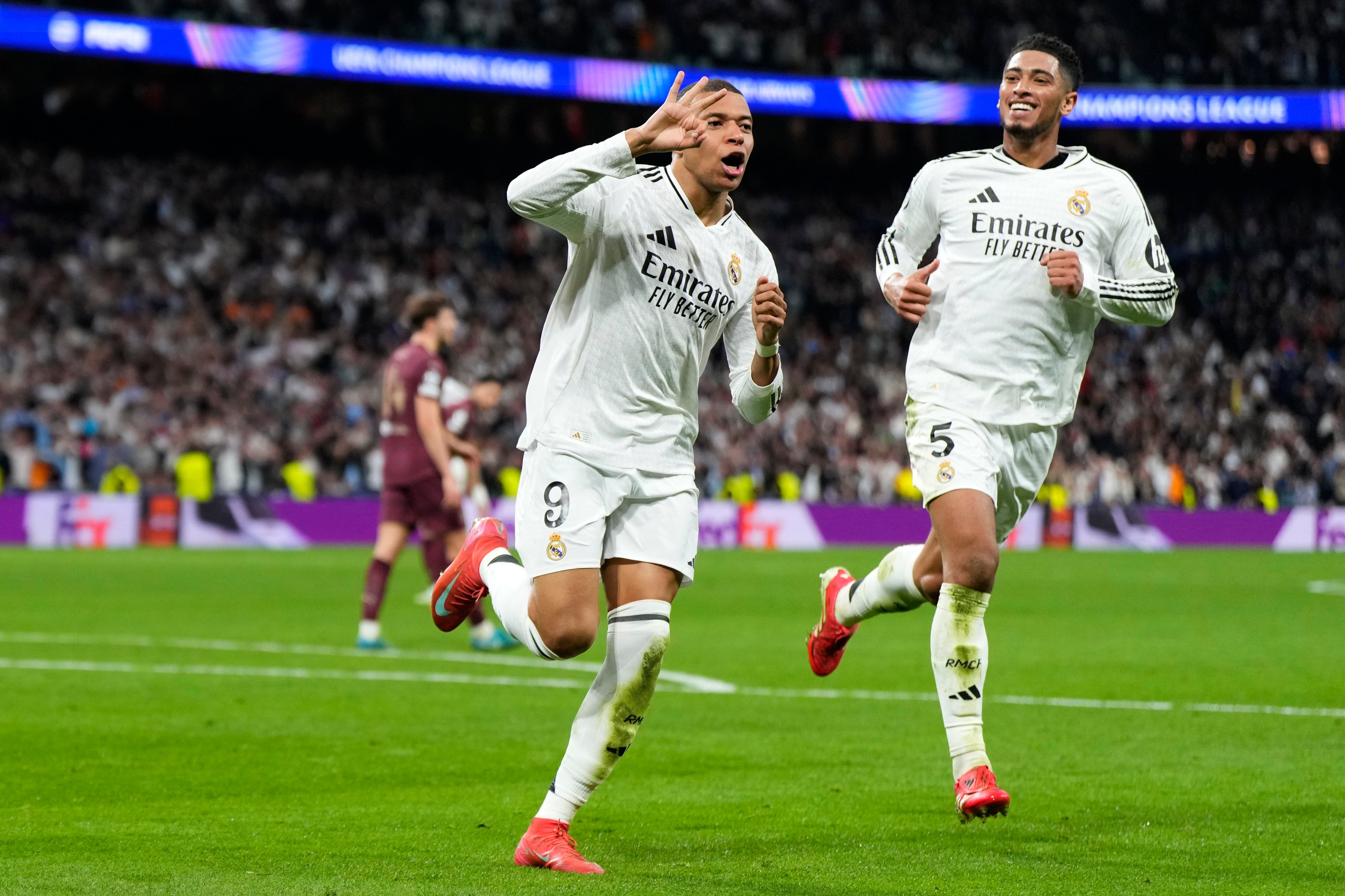 Real Madrid’s Kylian Mbappe (left) celebrates with Jude Bellingham after completing his hat-trick against Manchester City. Photo: AP