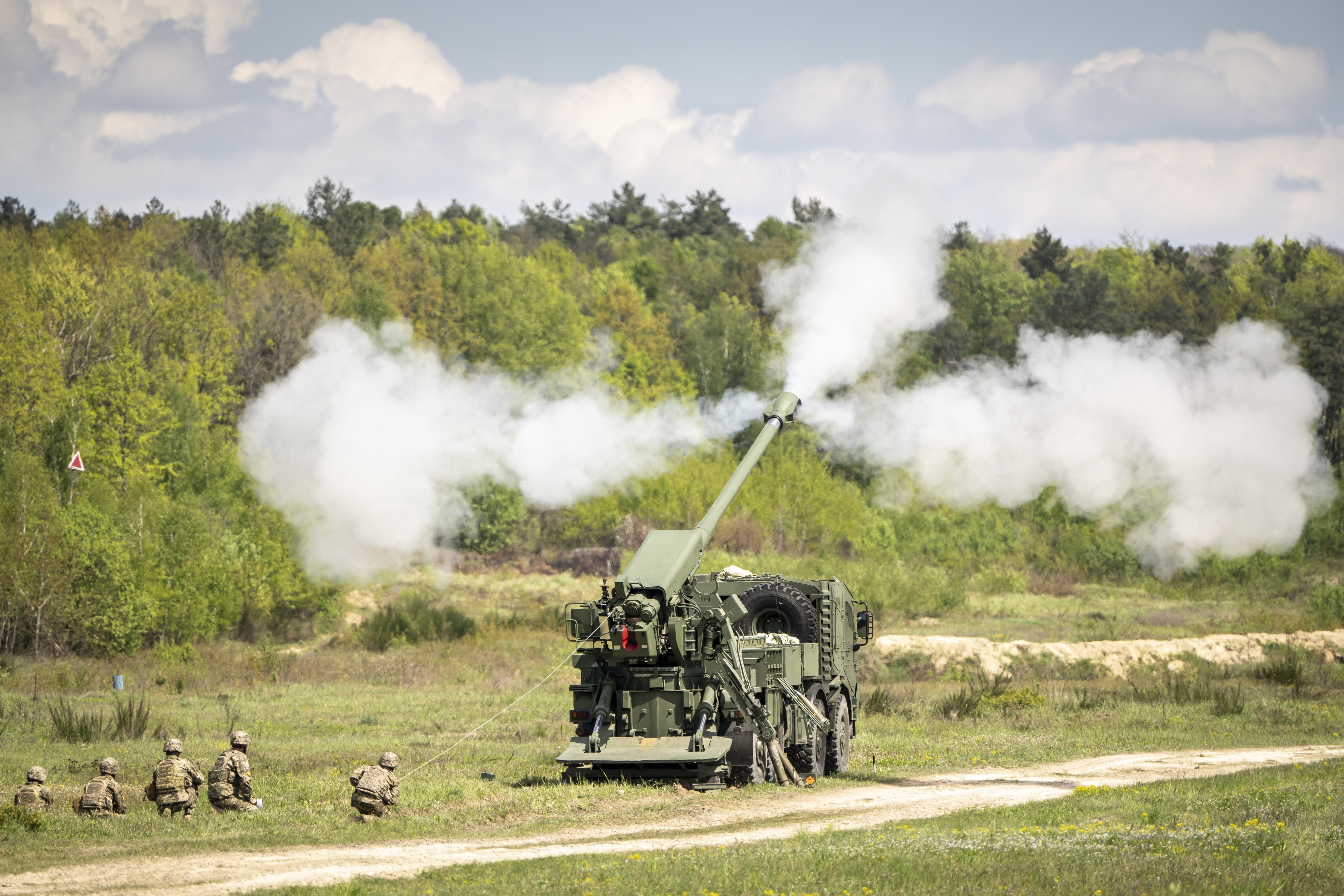 A demonstration of a self-propelled howitzer is held during Danish delegation’s visit to Lviv, Ukraine, in April 2024. Denmark is a big donor of military aid to Kyiv, but this has depleted its own ground forces   Photo: EPA-EFE