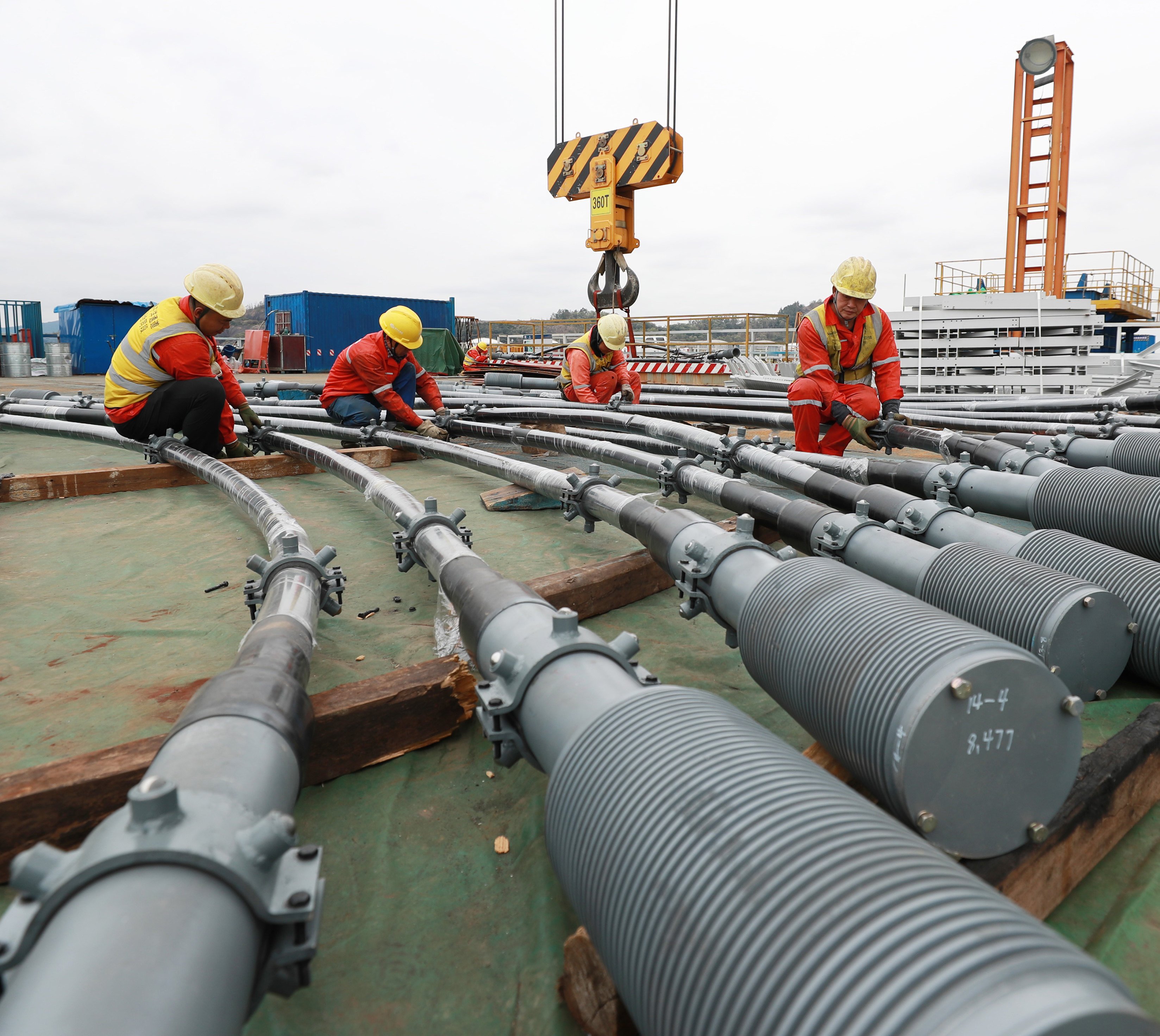 Men working on the Shiziyang grand bridge, part of the Shiziyang Channel mega-project to boost economic development around the Pearl River, in Guangdong, China on February. 7. Unlike many other governments, China’s has shown success in providing basic infrastructure across the nation. Photo: Xinhua