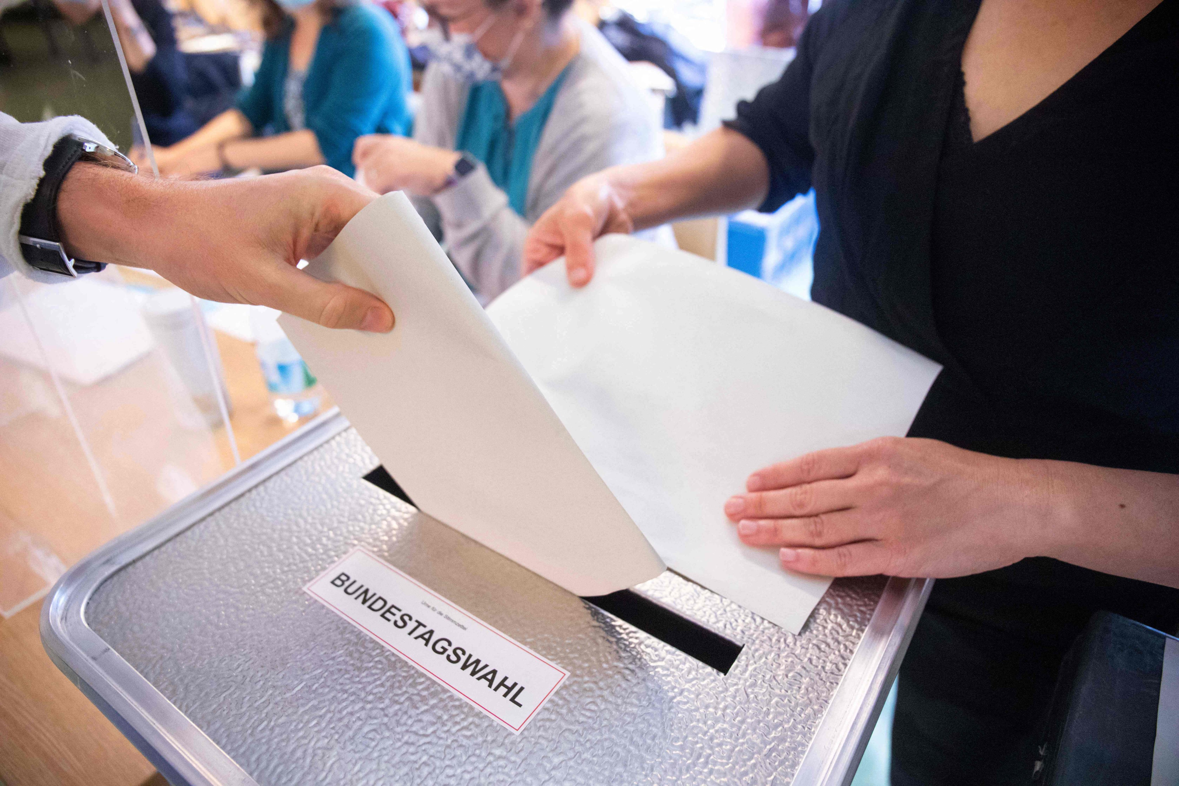 A voter casts a ballot for federal elections at a polling station in Berlin, during state and federal elections. Germany holds parliamentary elections on February 23, 2025. Photo: AFP