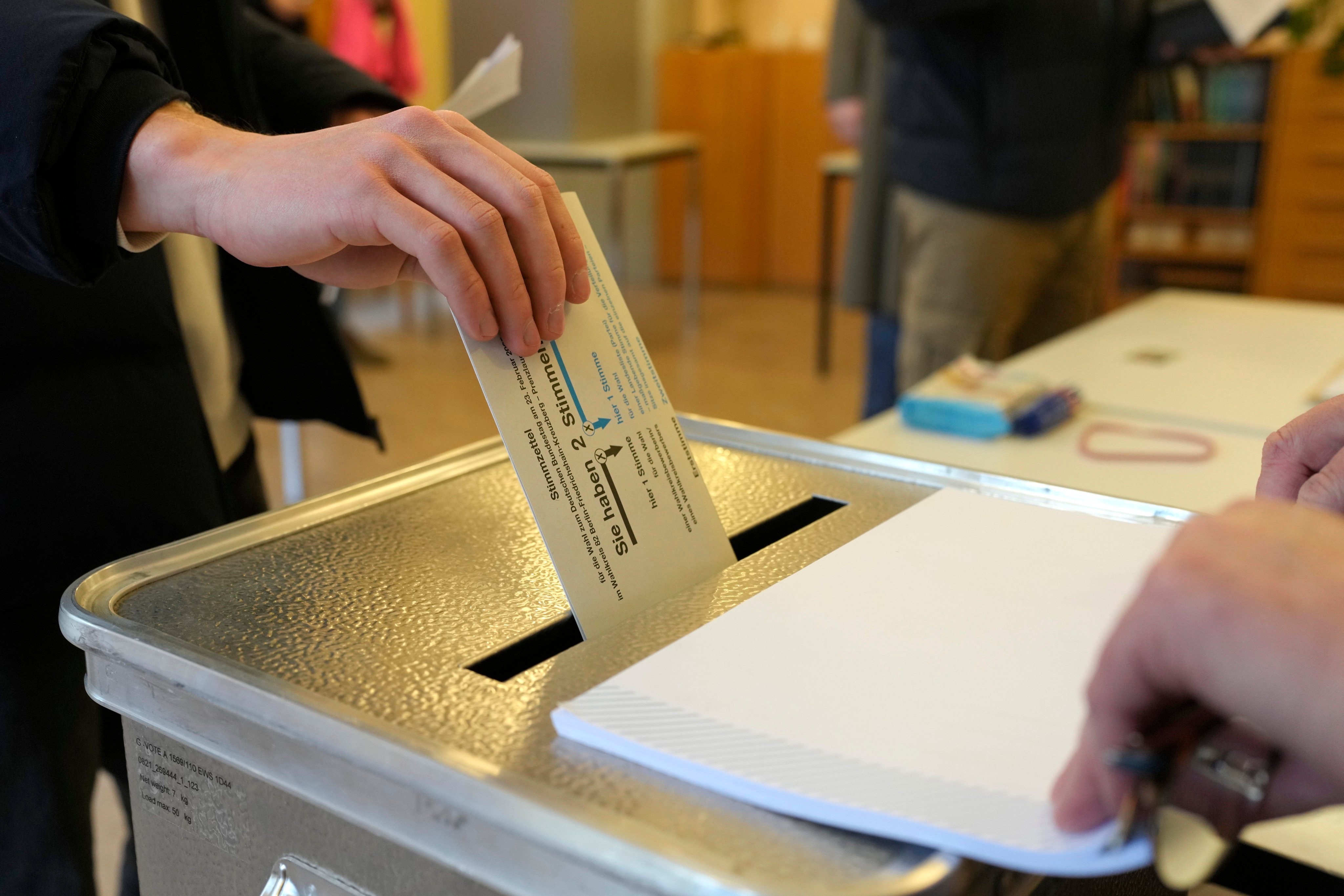 A resident casts a vote at a polling station in Berlin, Germany on February. 23, 2025, during the German national election. Photo: AP