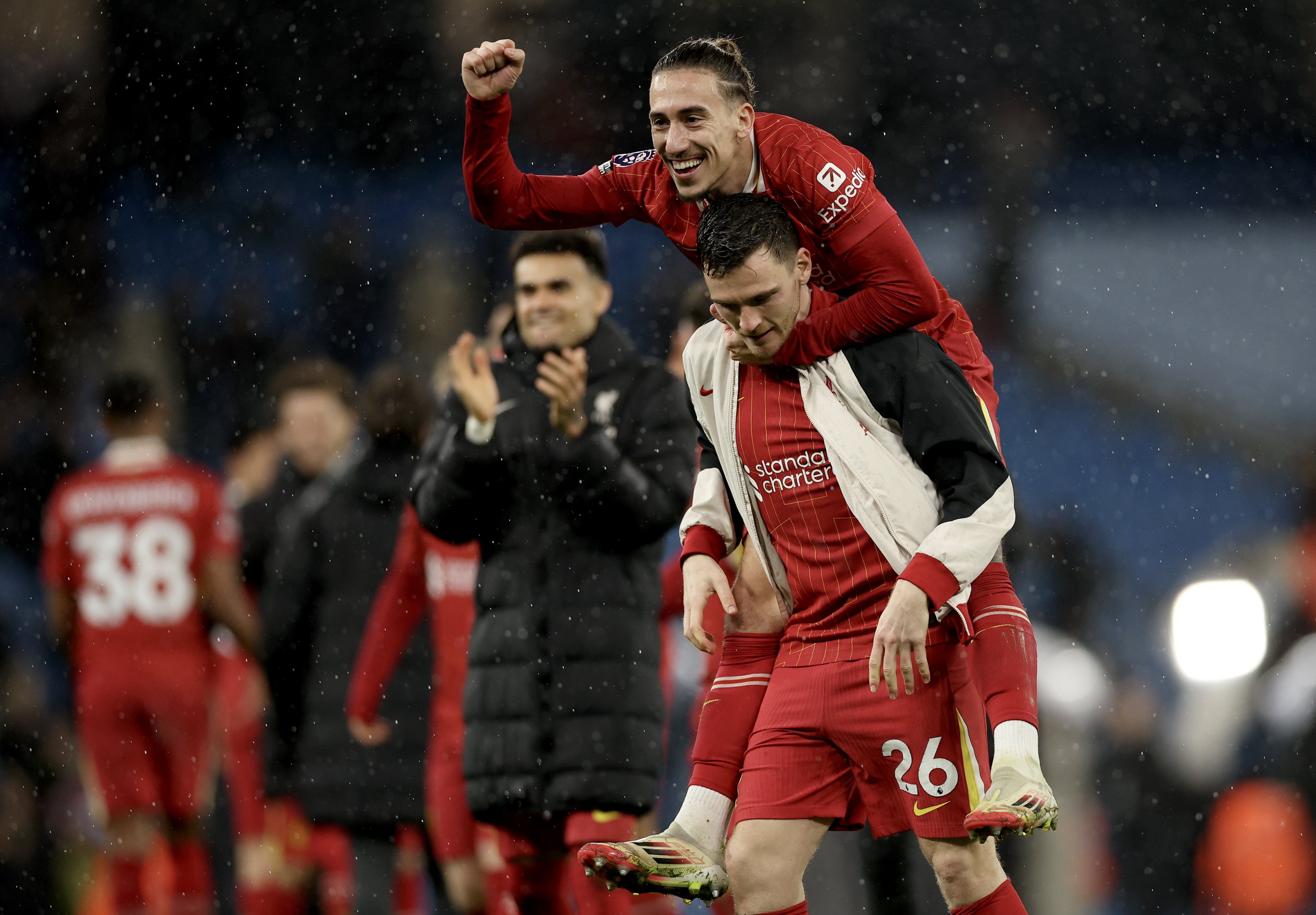 Liverpool duo Konstantinos Tsimikas (top) and Andrew Robertson (down) celebrate the potentially season-defining victory over Manchester City and Liverpool FC, in Manchester. Photo: EPA