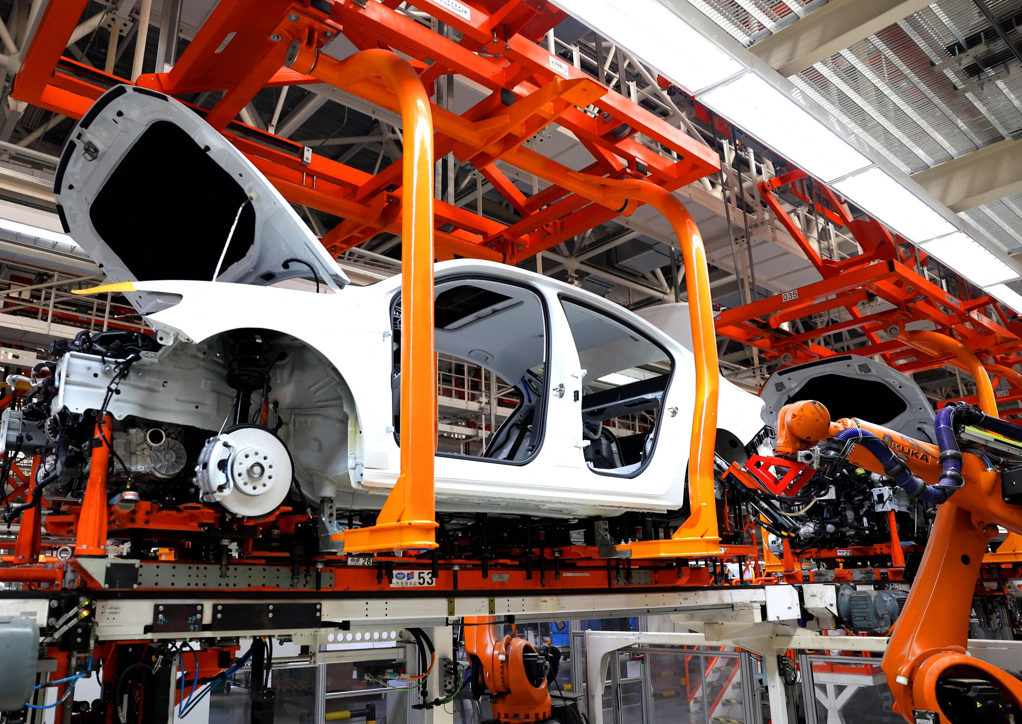 Robots carry out operations in the body shop of the FAW-Volkswagen production based in Qingdao, eastern Shandong province, on February 19. Photo: AFP