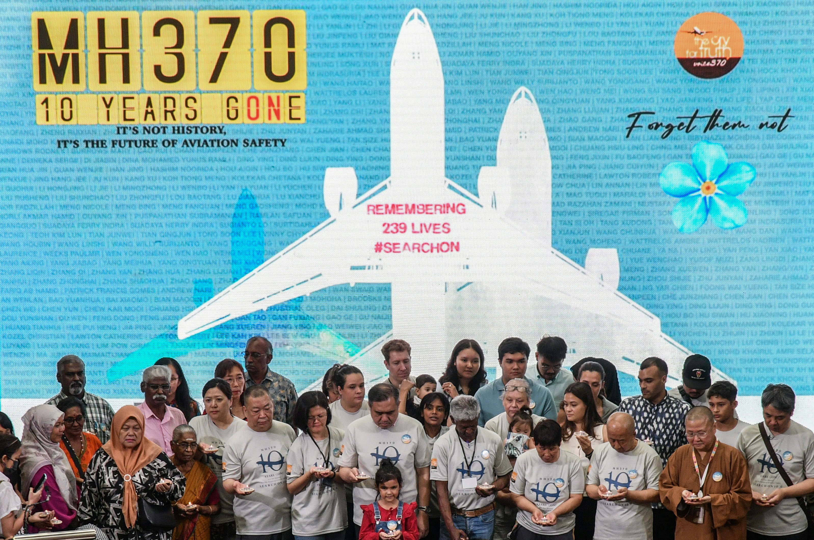 Family members of passengers and crew on board missing flight MH370 and Malaysia’s Transport Minister, Loke Siew Fook at an event in Subang Jaya last year marking the 10th anniversary of its disappearance. Photo: EPA-EFE