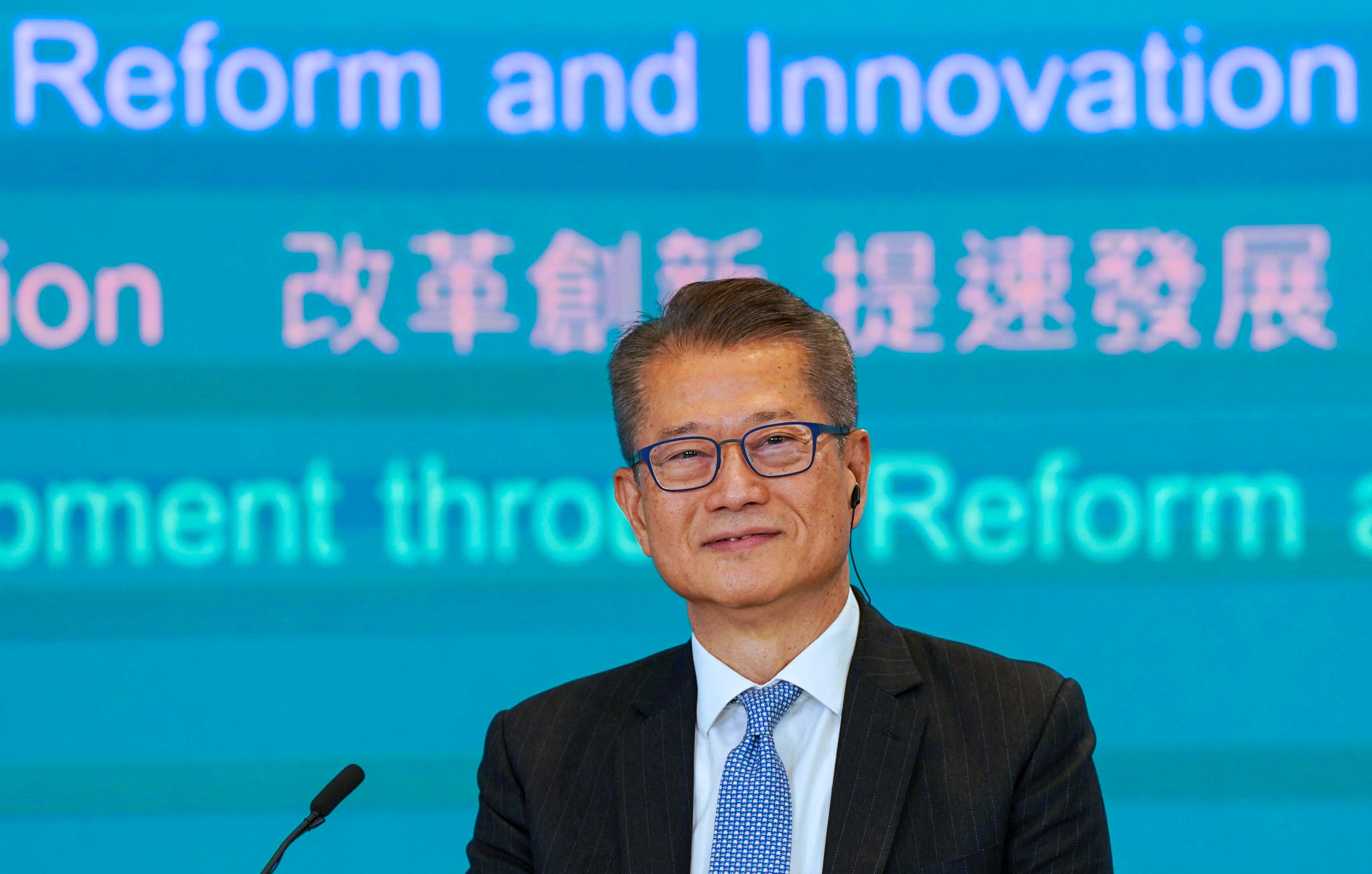 Financial Secretary Paul Chan at a joint radio phone-in programme. Photo: Elson Li