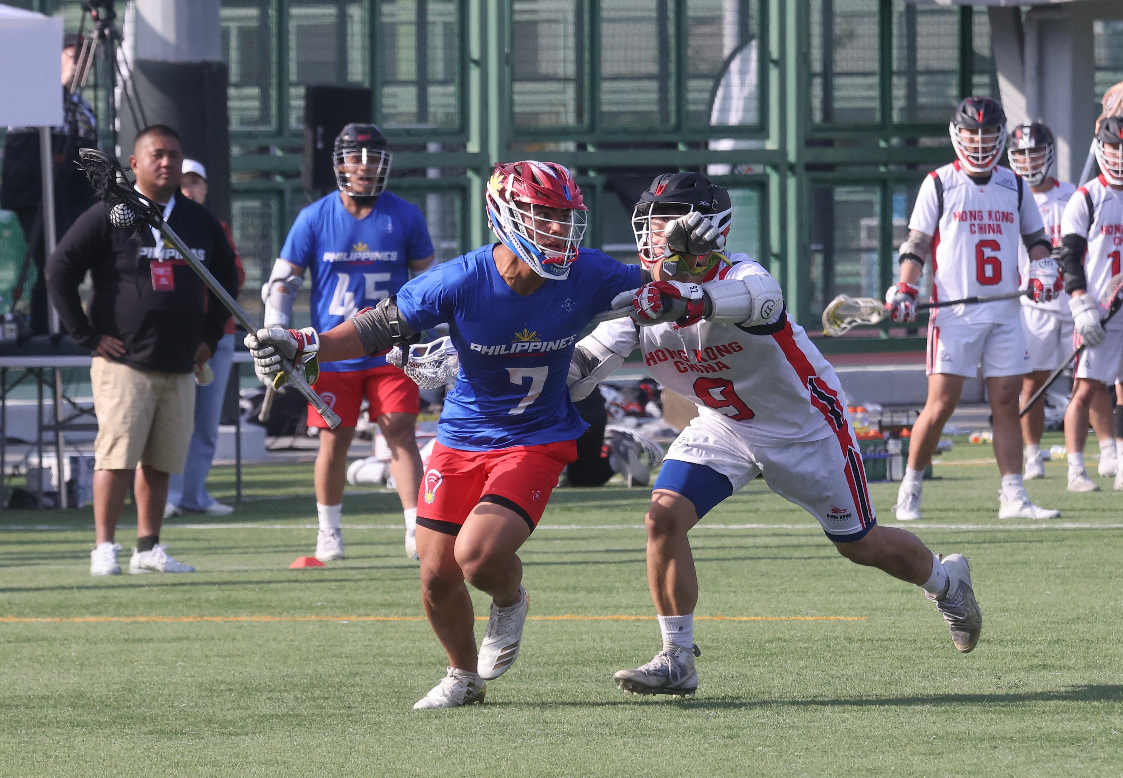 The Philippines’ Jon Dugenio (left) battles with Hong Kong’s Lai Kwok-wang during a World Lacrosse Super Sixes game at Wong Chuk Hang Sports Ground last December. Photo: Jonathan Wong