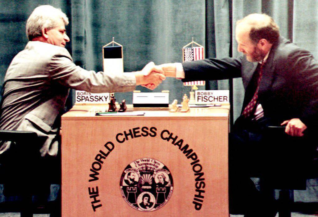 Boris Spassky (left) shakes hands with Bobby Fischer at the beginning of their unofficial rematch in Yugoslavia in September 1992. Photo: AFP