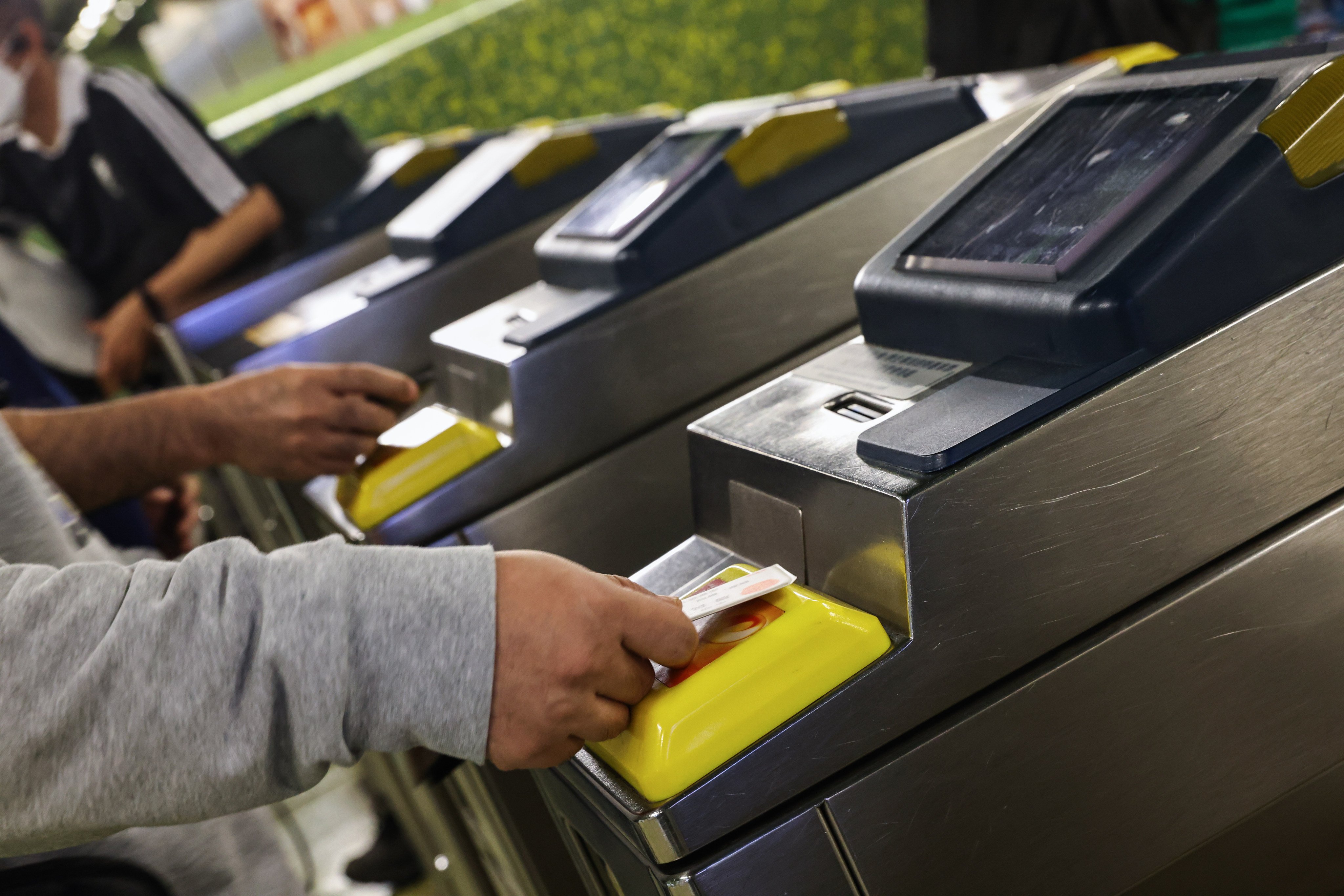 MTR commuters using Octopus cards at turnstiles. The stored-value card was at the cutting edge when introduced in 1997 but its pioneering days are now behind it. Photo: K. Y. Cheng