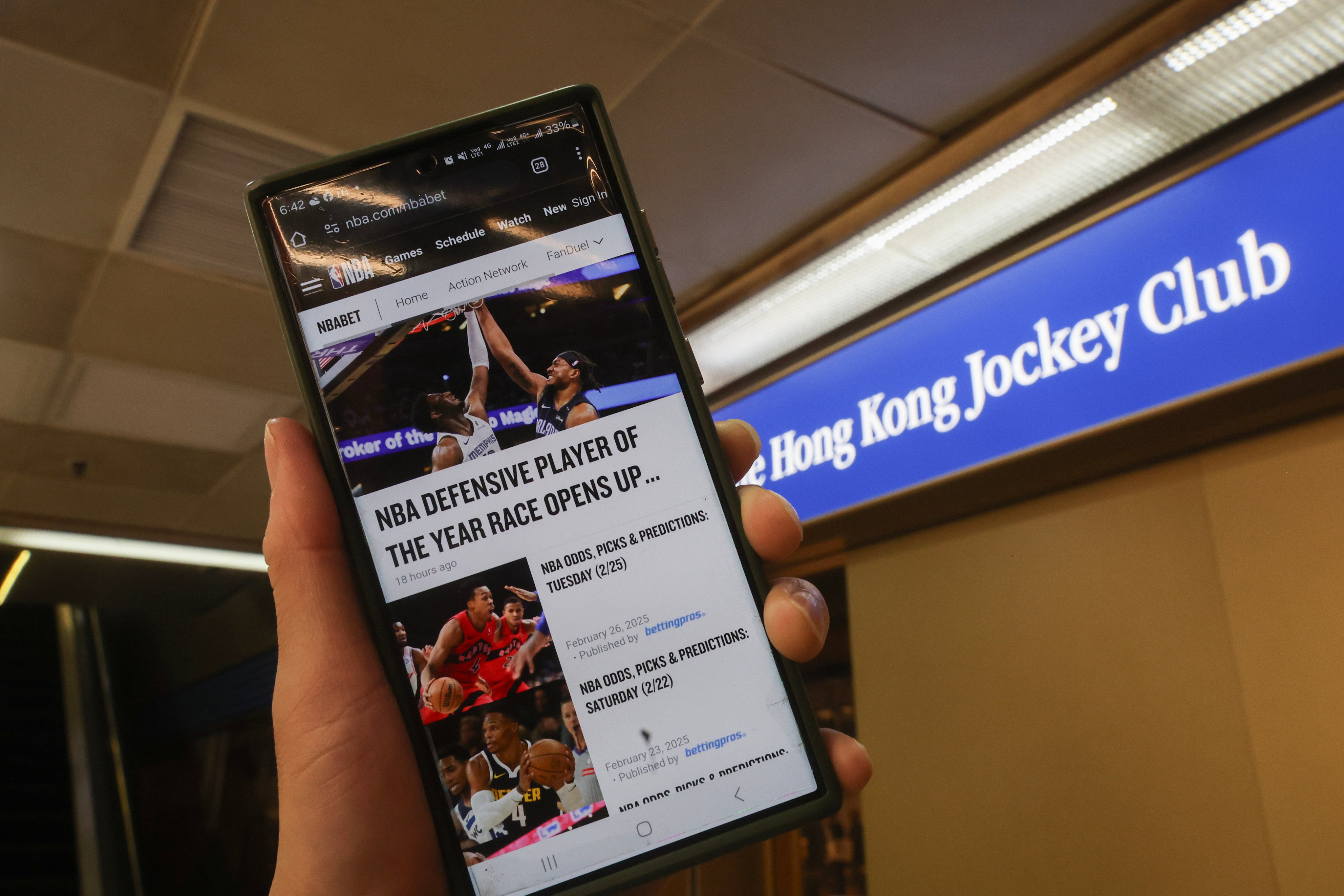 The NBABET website is seen at a Hong Kong Jockey Club Betting Branch in Kwun Tong. The Hong Kong Jockey Club is discussing with authorities for basketball betting to be legalised as soon as September. Photo: Edmond So