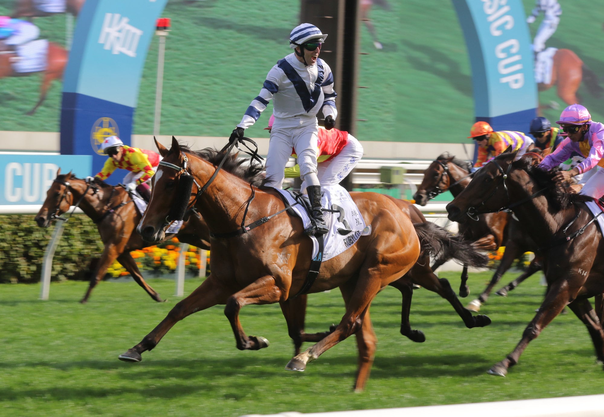 A jubilant Brenton Avdulla wins the Classic Cup (1,800m) with Rubylot.