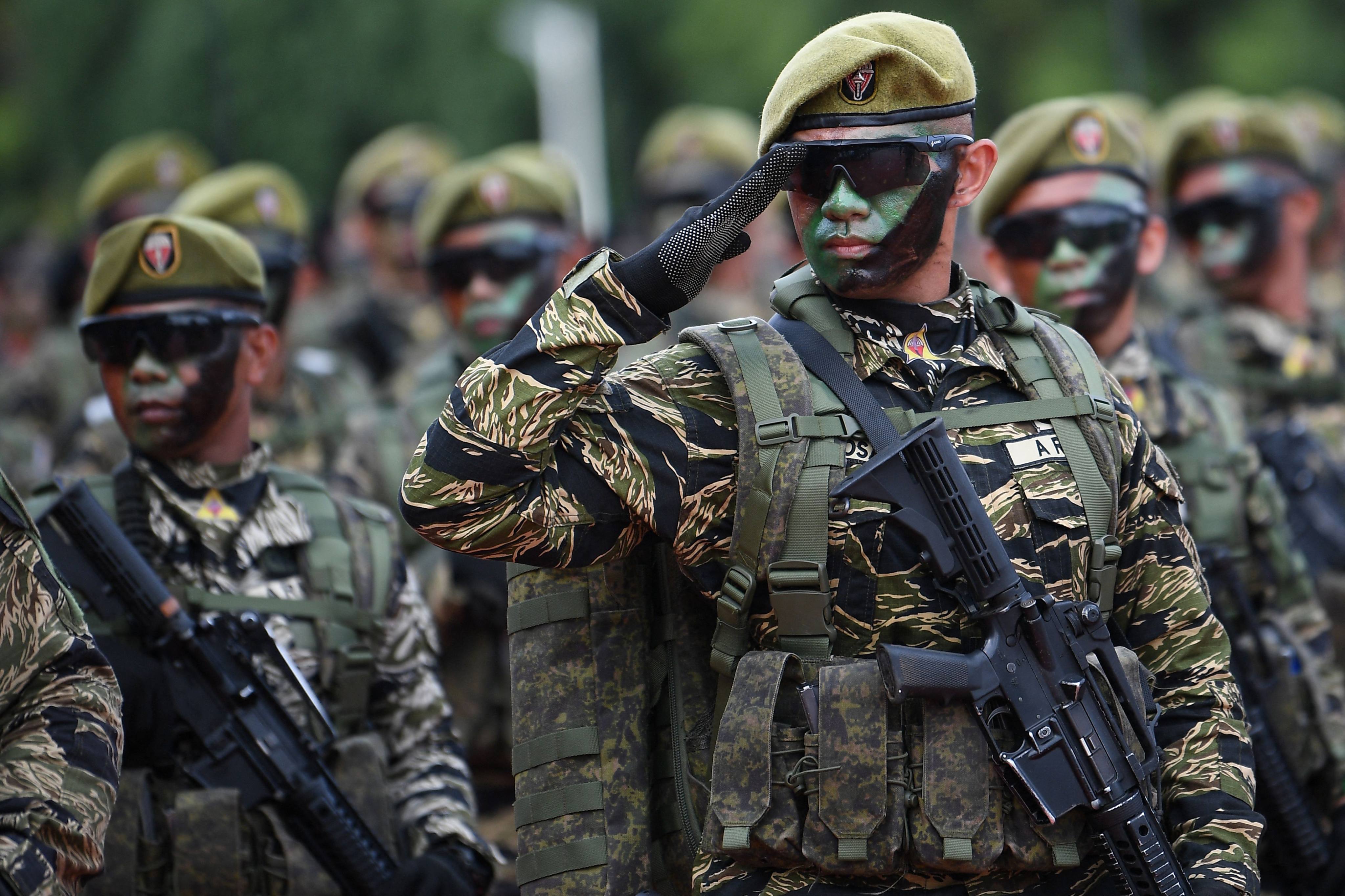 Soldiers march during a military parade held to mark the 89th founding anniversary of the Armed Forces of the Philippines at Camp Aguinaldo in Manila on December 20, 2024. Photo: AFP