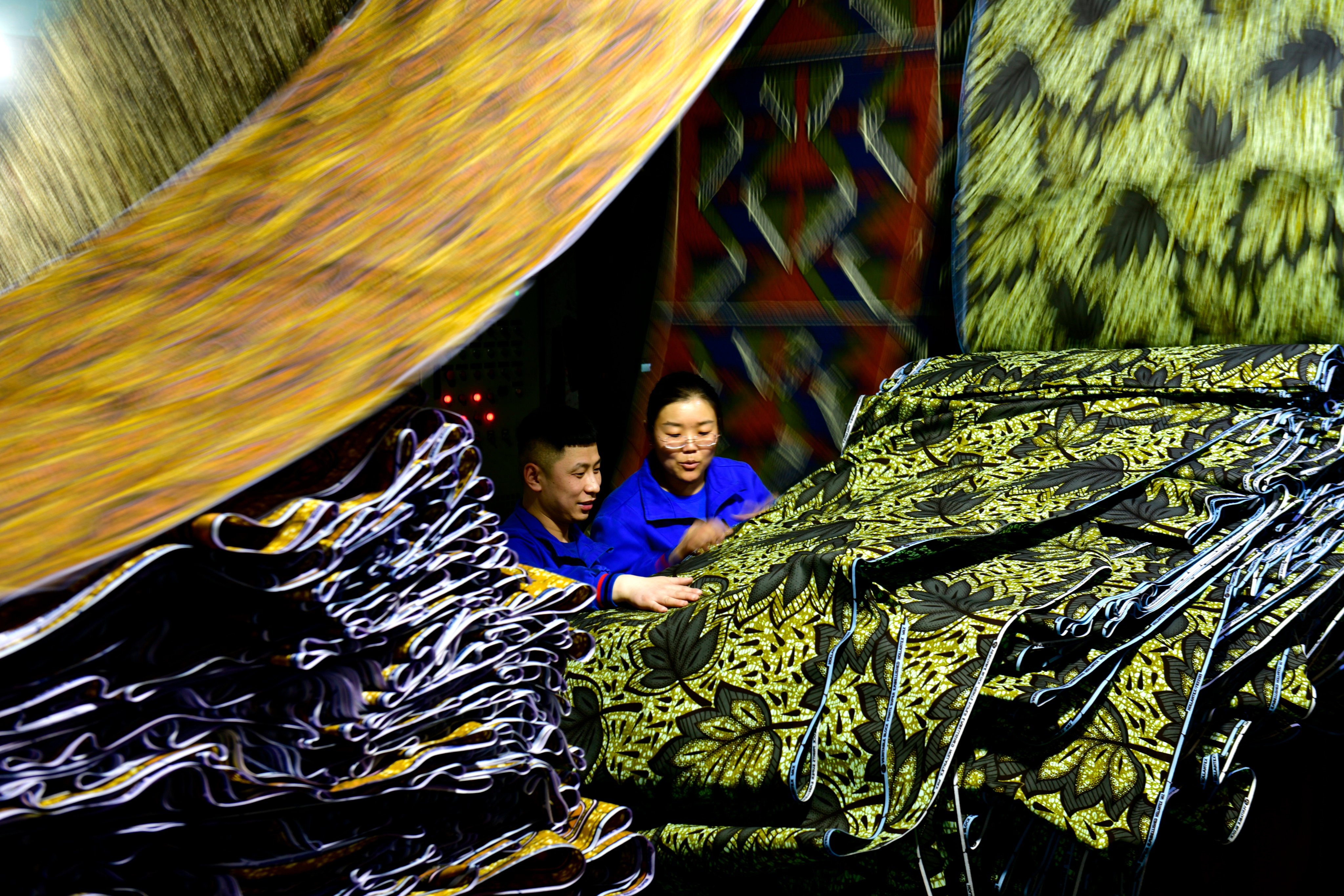 Workers checking fabric for export to Africa at a workshop in Binzhou in east China’s Shandong province on February 25. While trade tensions exist, China is diversifying its trade relationships. Photo: Xinhua