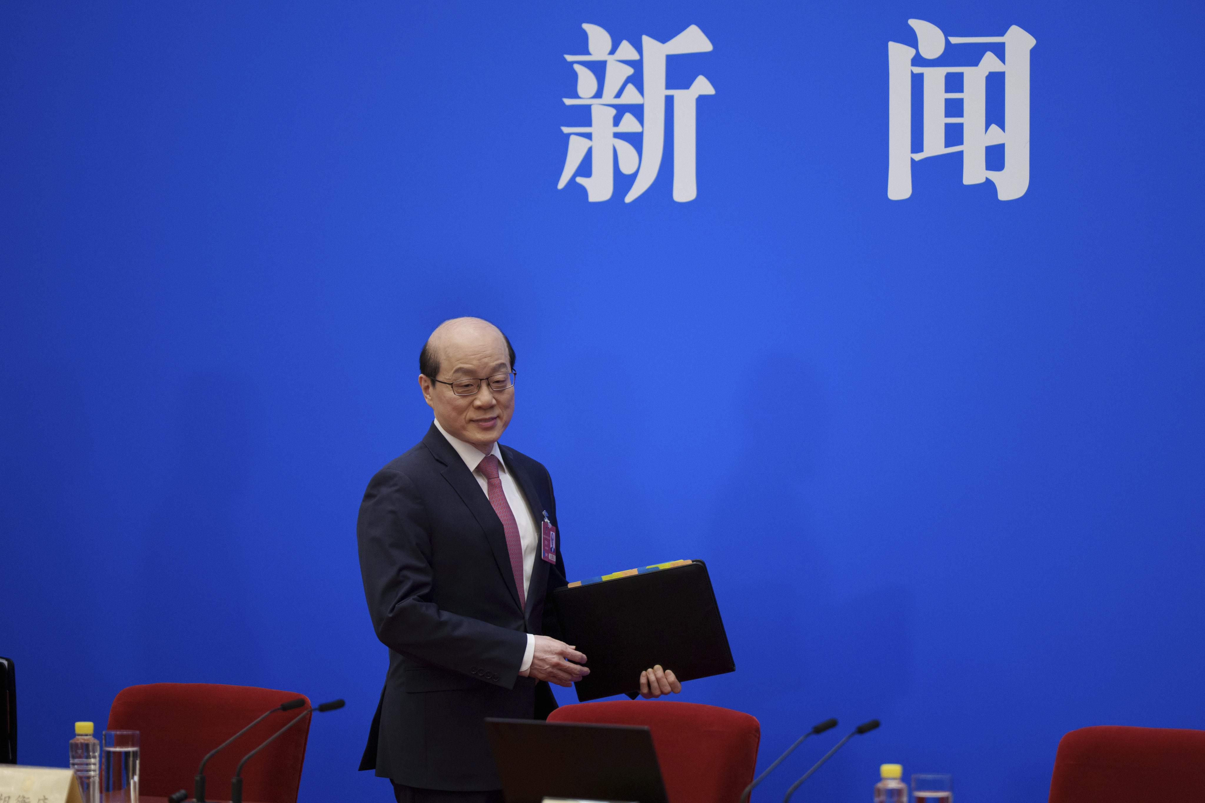 Liu Jieyi, spokesman for China’s top political advisory body, arrives for a press conference ahead of the opening of the Chinese People’s Political Consultative Conference at the Great Hall of the People in Beijing on Monday. Photo: AP