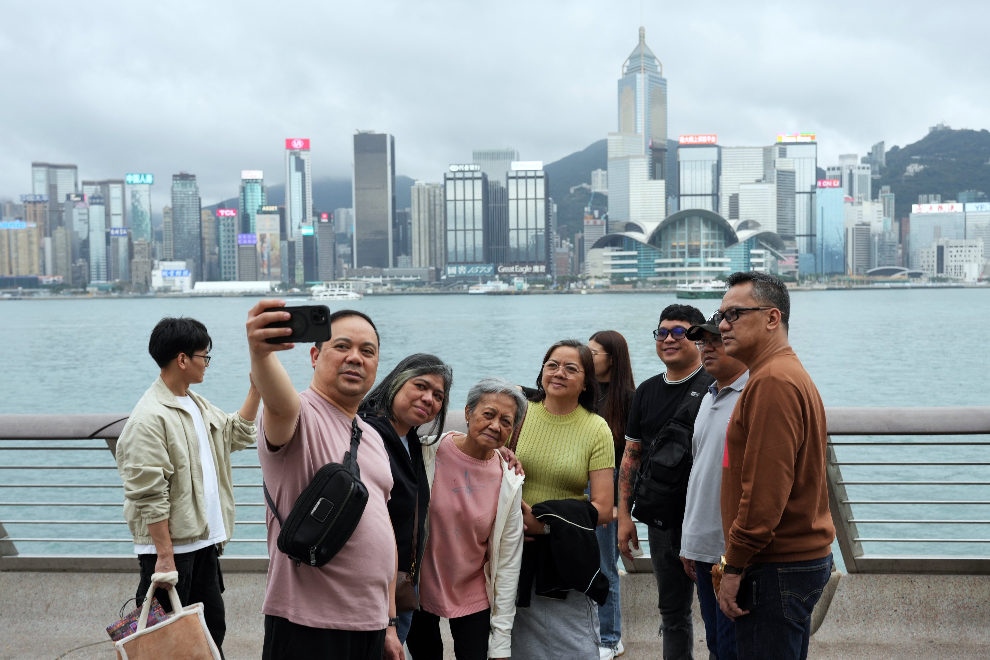 Tourists from the Philippines explore the Avenue of Stars in Tsim Sha Tsui. Photo: May Tse