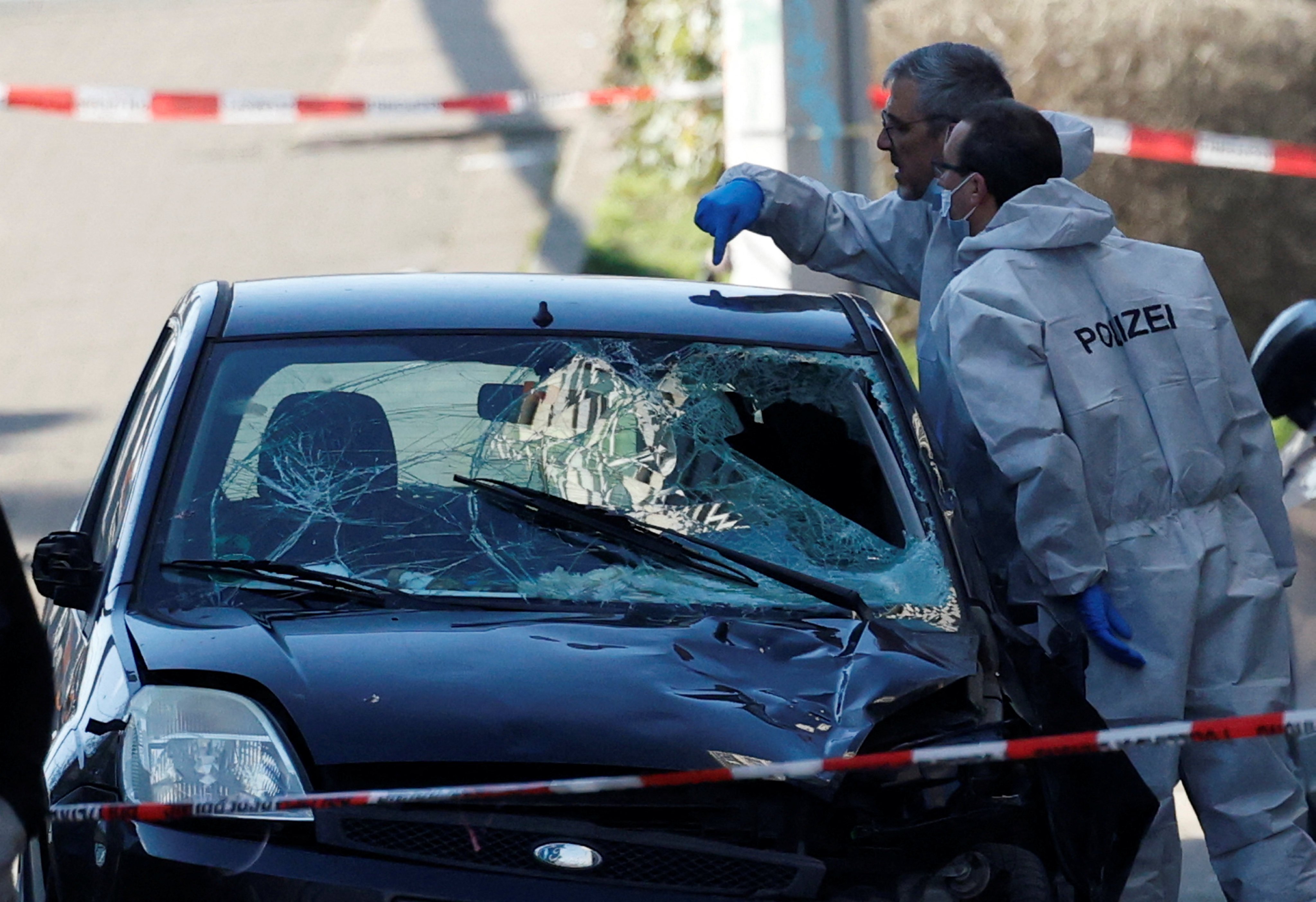 Police examine the vehicle used in the attack. Photo: Reuters