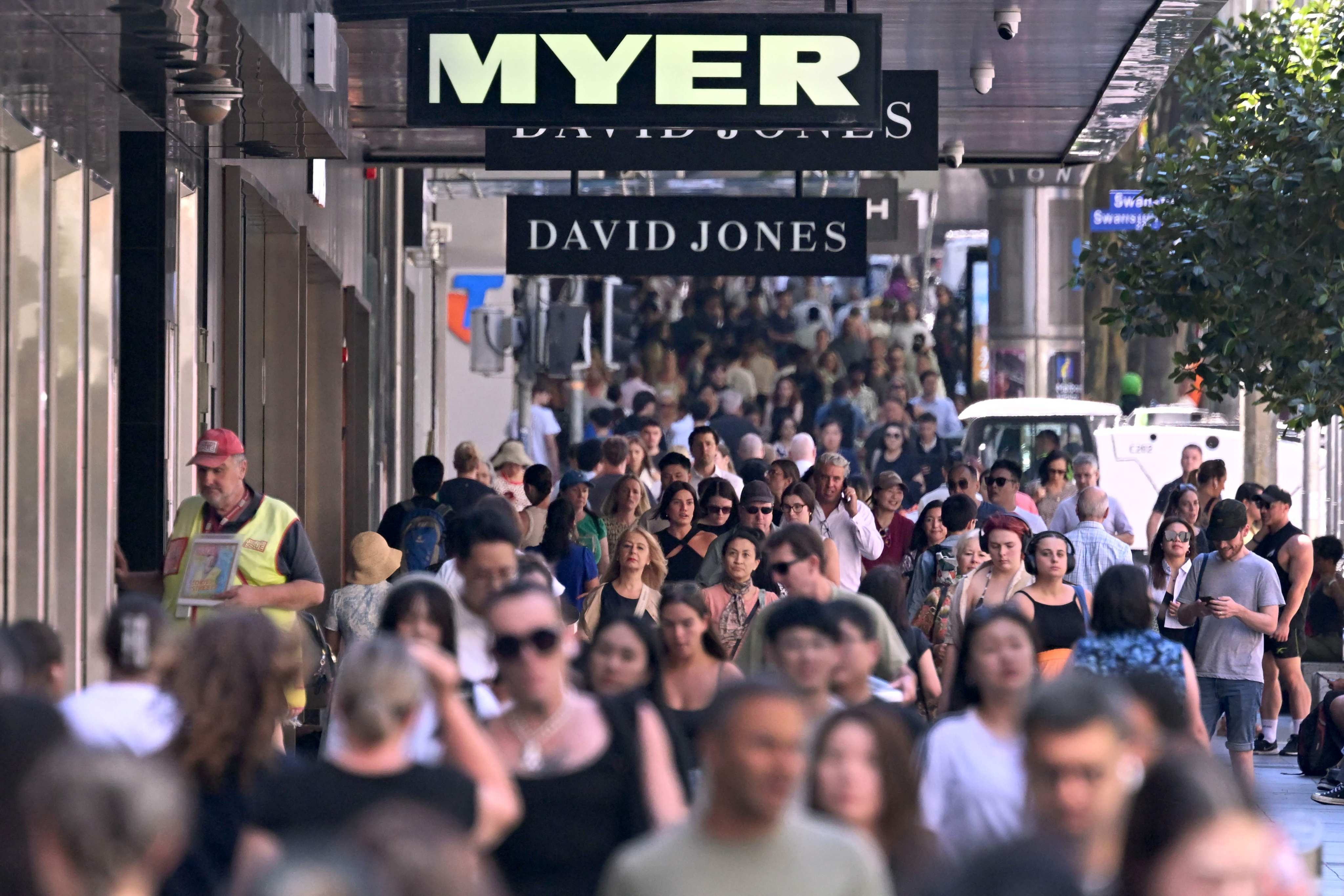 People at Melbourne’s Bourke Street Mall. Australia passed legislation mandating the reporting of gender pay gaps for companies with more than 100 employees in 2023. Photo: AFP