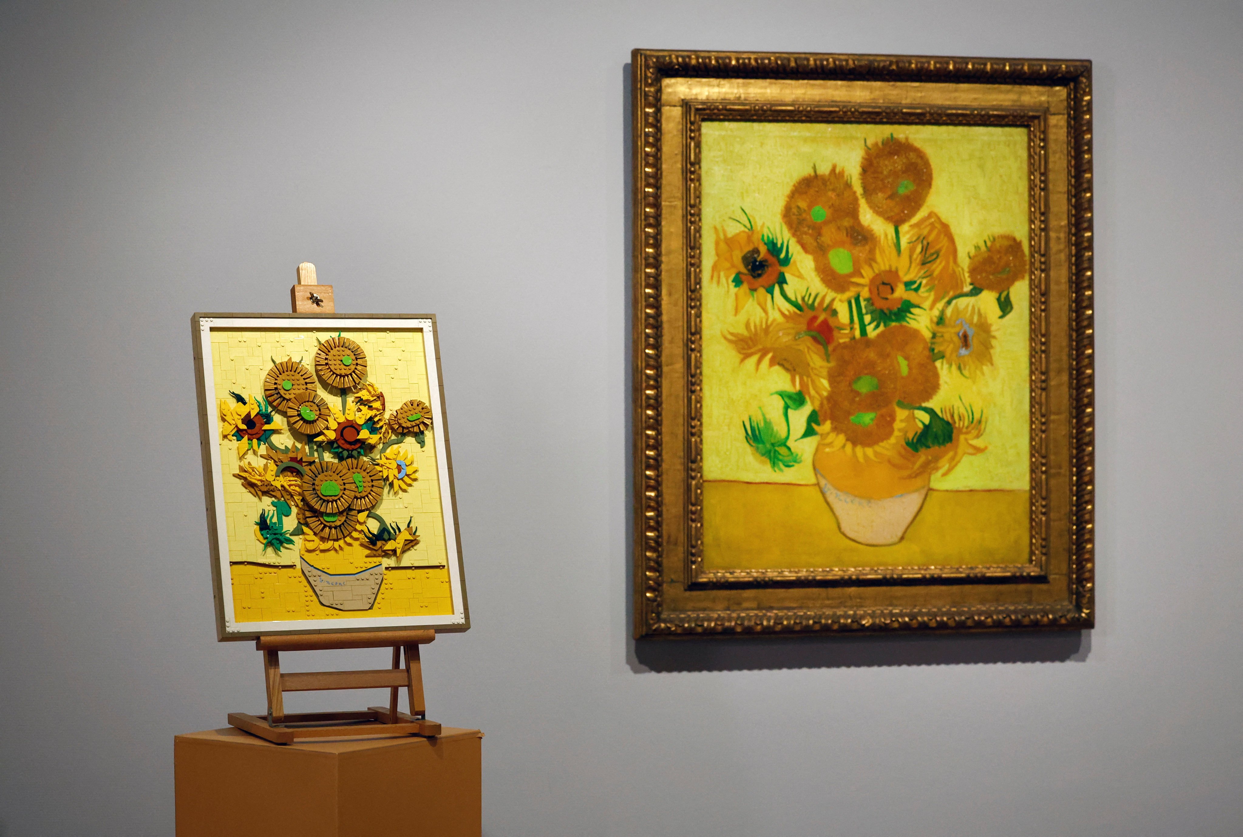 A Lego recreation of one of Vincent Van Gogh’s Sunflowers paintings on display next to the actual painting in the Van Gogh Museum in Amsterdam. Lego fans can buy a 2,615-piece brick set to take home and make their own Sunflowers. Photo: Reuters