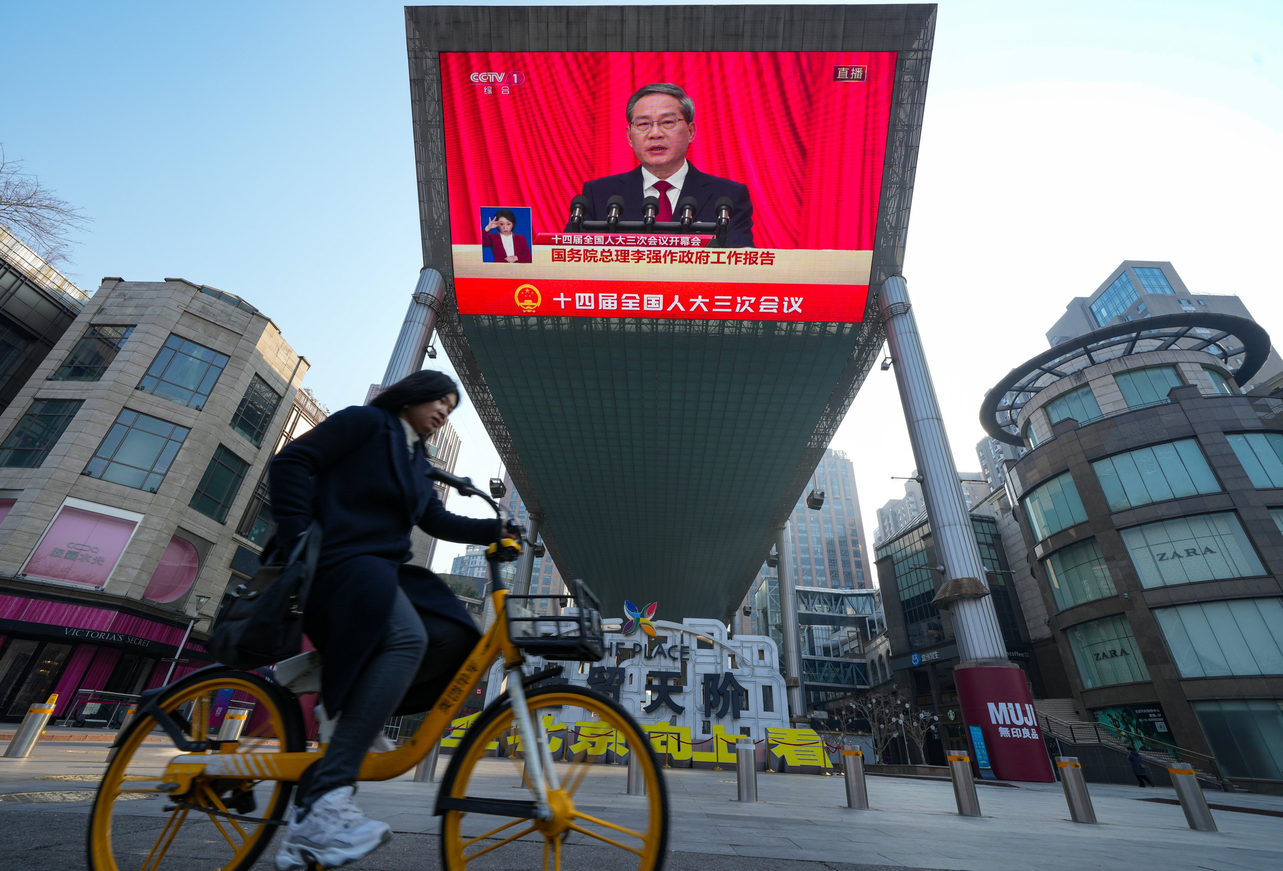 A screen broadcasting live footage of China’s Premier Li Qiang at the opening of the annual session of the National People’s Congress (NPC) in Beijing. Photo: Robert Ng