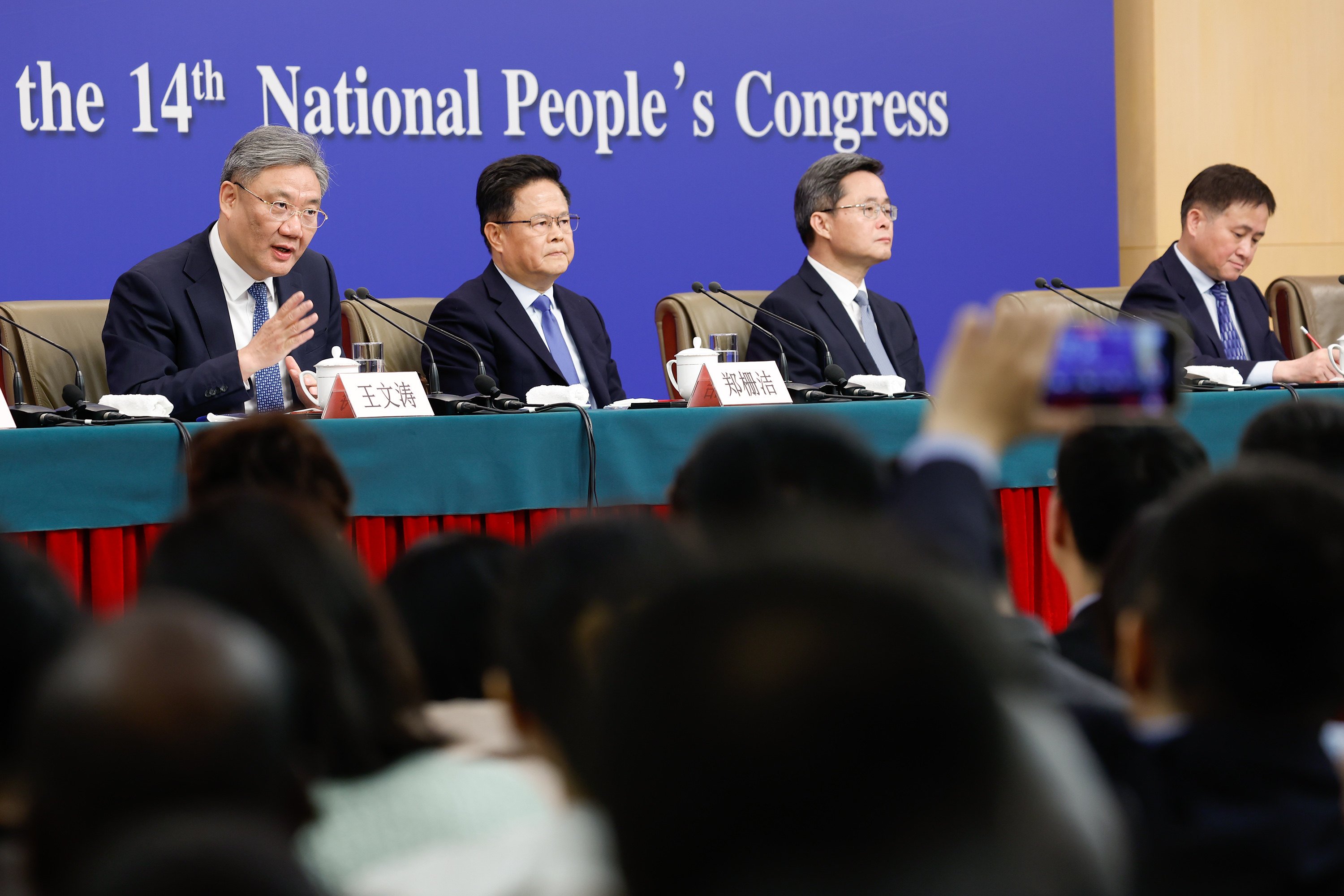 The heads of China’s major economic institutions held a press conference on the sidelines of the “two sessions”. Photo: Xinhua