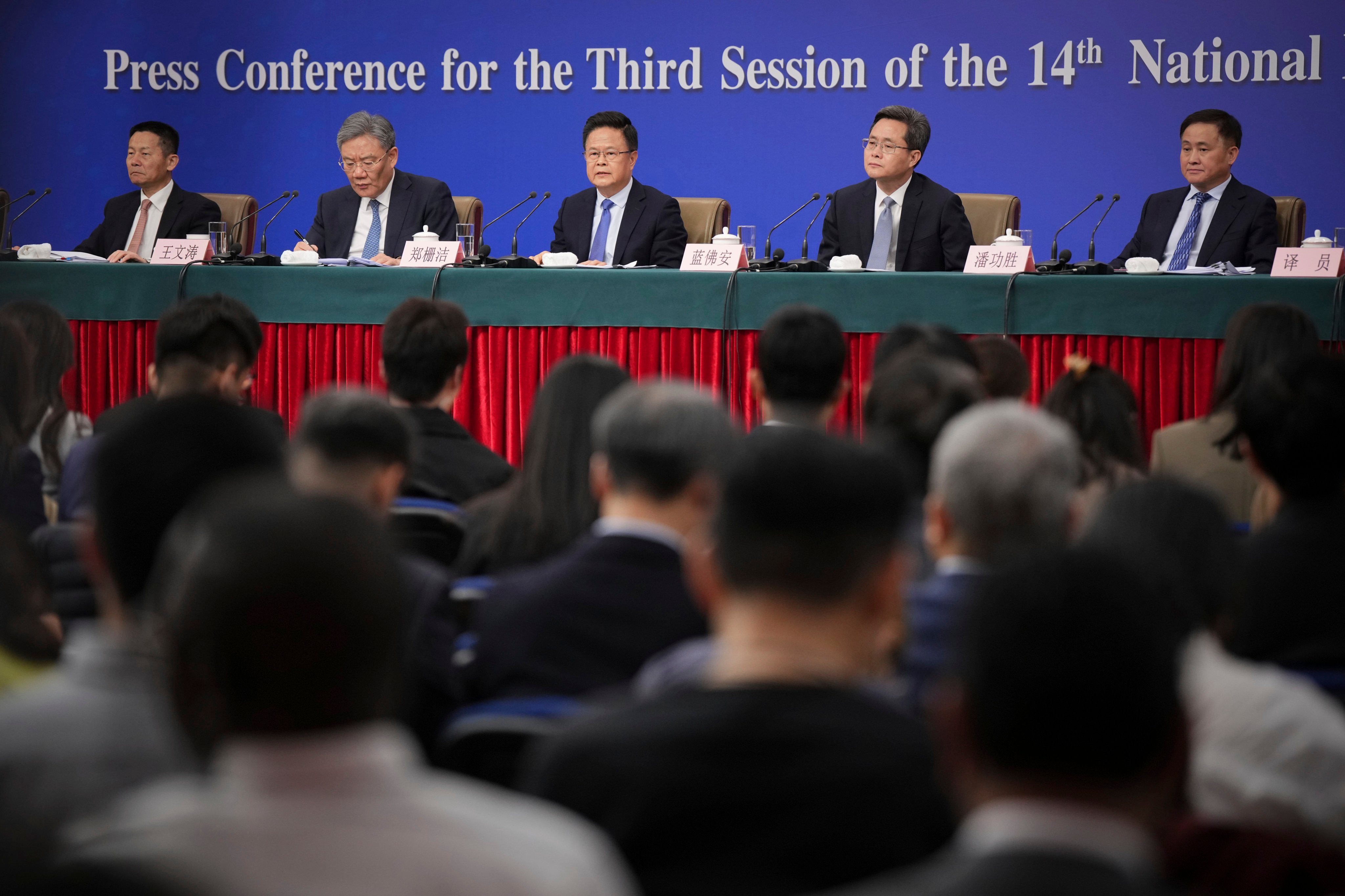 China’s top finance and economic officials address the media as part of the annual ‘two sessions’, in Beijing on Thursday. Photo: AP